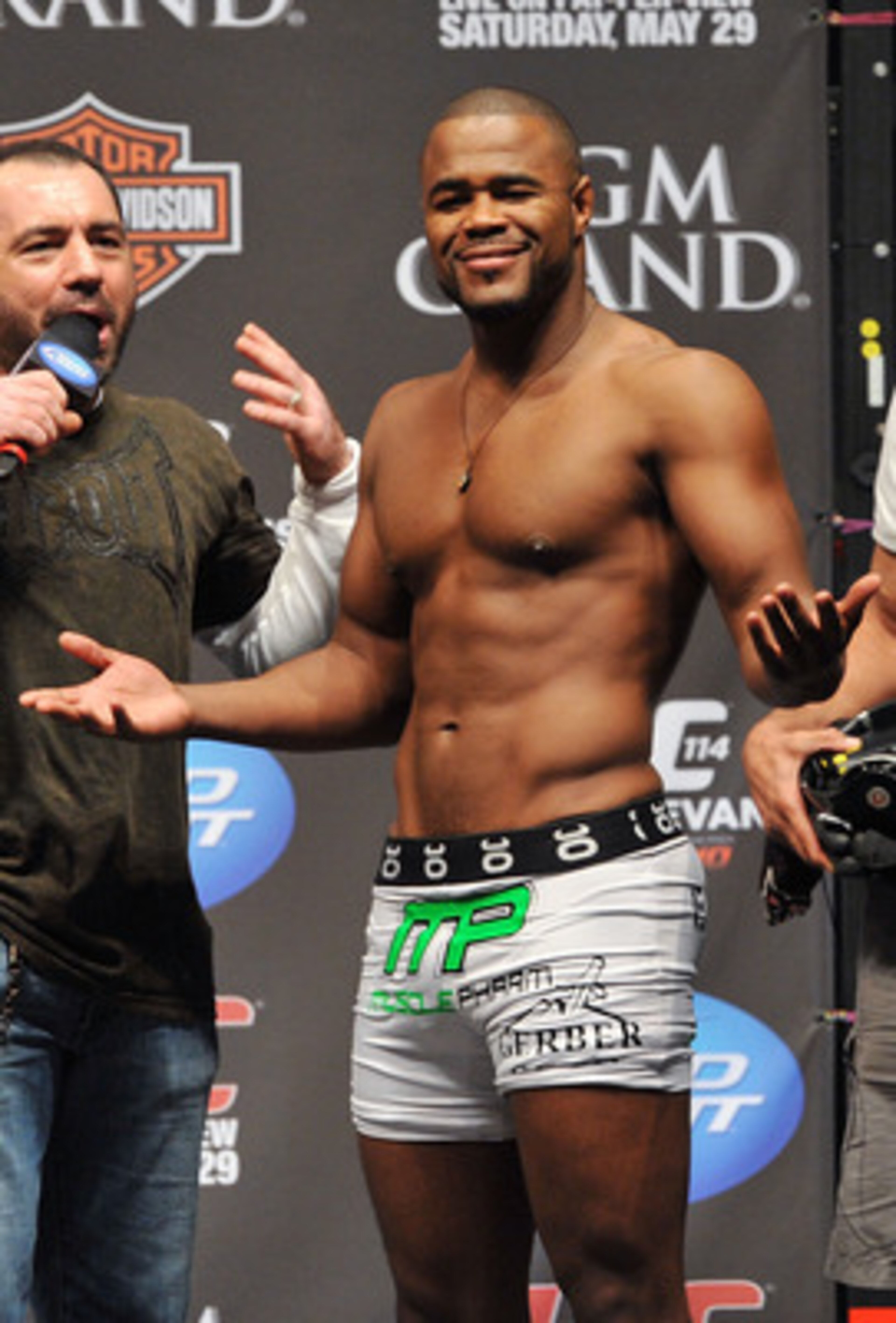 LAS VEGAS - MAY 28:  UFC fighter Rashad Evans (R) reacts to the crowd while speaking to UFC announcer Joe Rogan (L) about his fight against UFC fighter Quinton 'Rampage' Jackson at UFC 114: Rampage versus Rashad at the Mandalay Bay Hotel on May 28, 2010 i