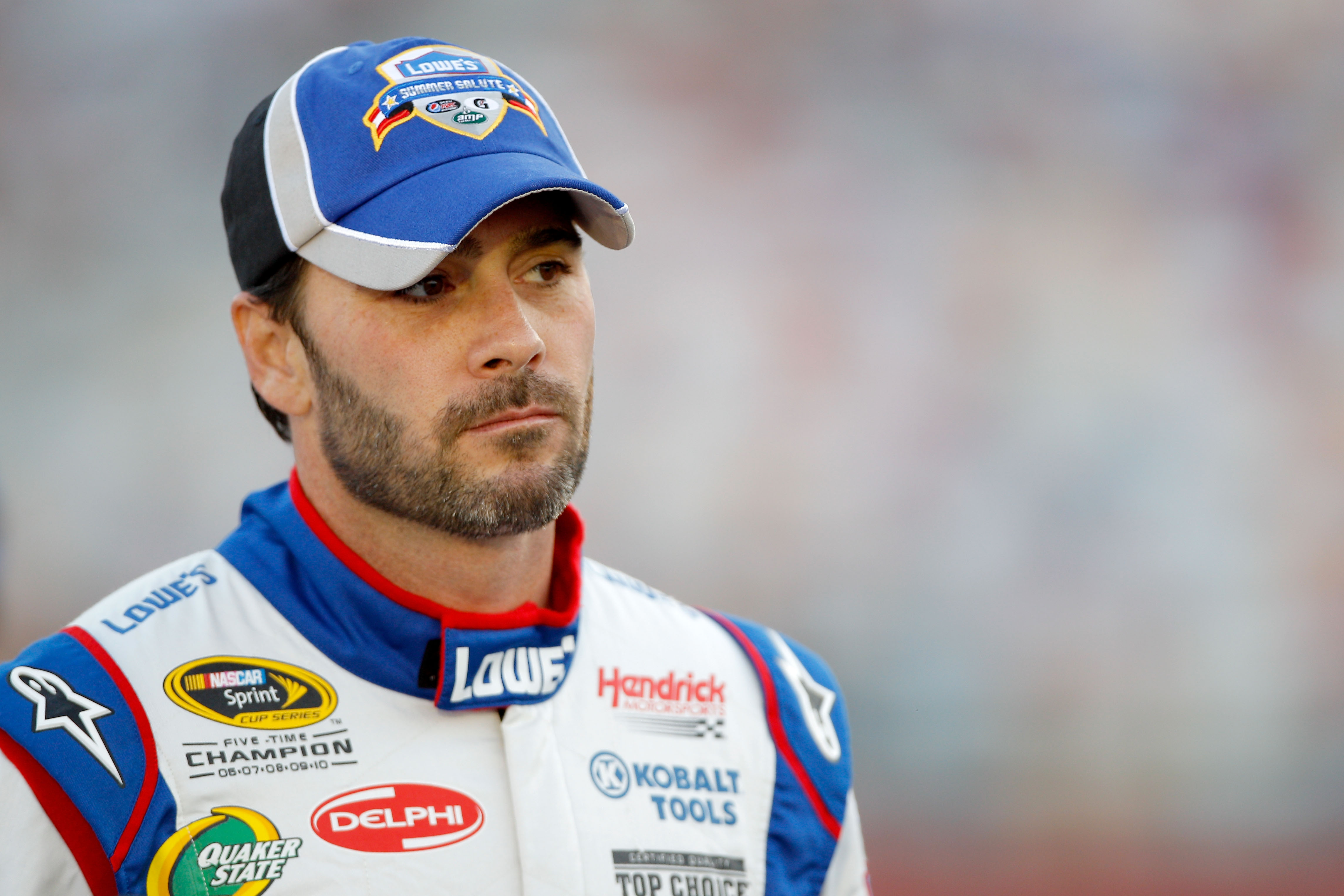 CHARLOTTE, NC - MAY 26:  Jimmie Johnson, driver of the #48 Lowe's Summer Salute Chevrolet, stands on the grid during qualifying for the NASCAR Sprint Cup Series Coca-Cola 600 at Charlotte Motor Speedway on May 26, 2011 in Charlotte, North Carolina.  (Phot