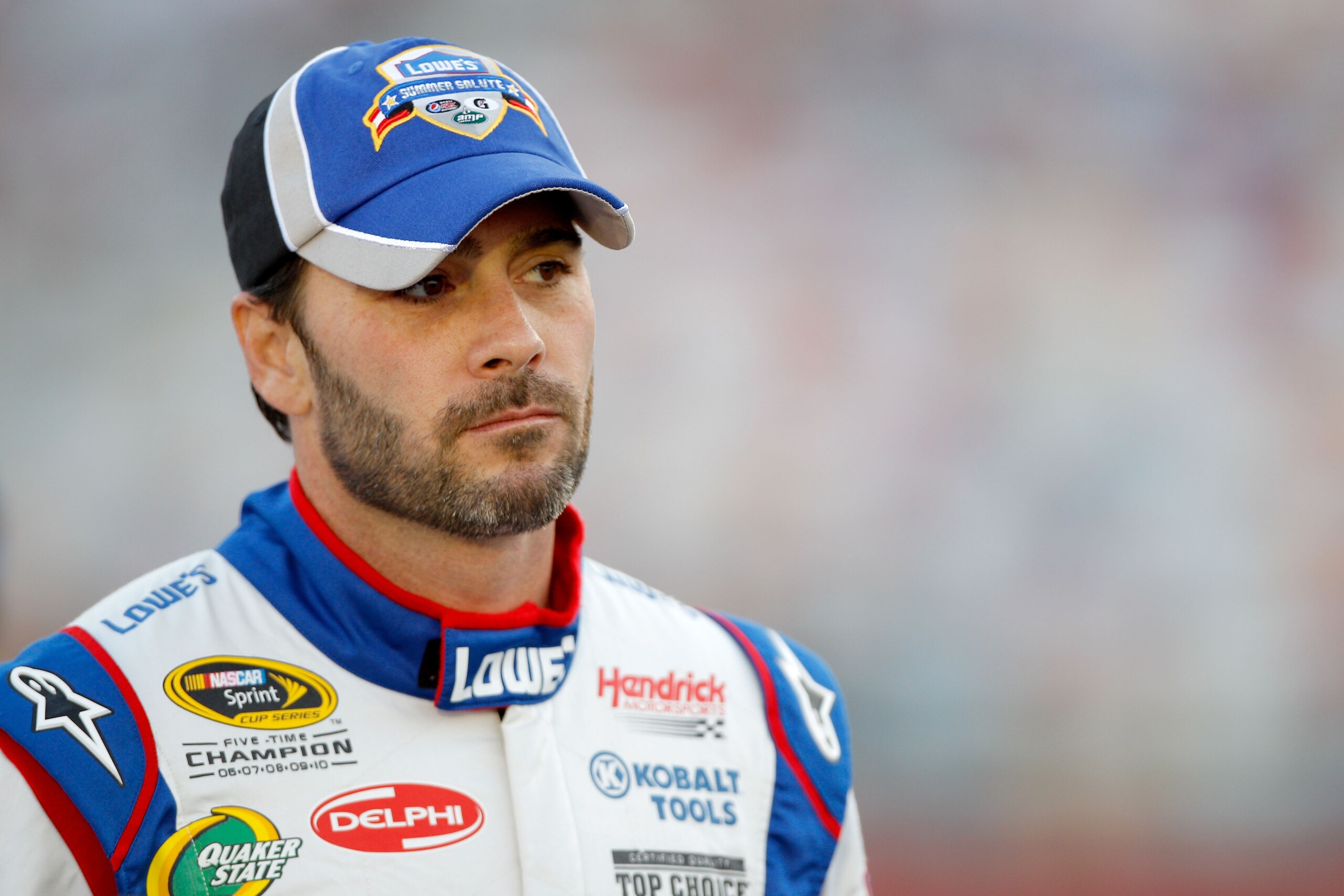 CHARLOTTE, NC - MAY 26:  Jimmie Johnson, driver of the #48 Lowe's Summer Salute Chevrolet, stands on the grid during qualifying for the NASCAR Sprint Cup Series Coca-Cola 600 at Charlotte Motor Speedway on May 26, 2011 in Charlotte, North Carolina.  (Phot