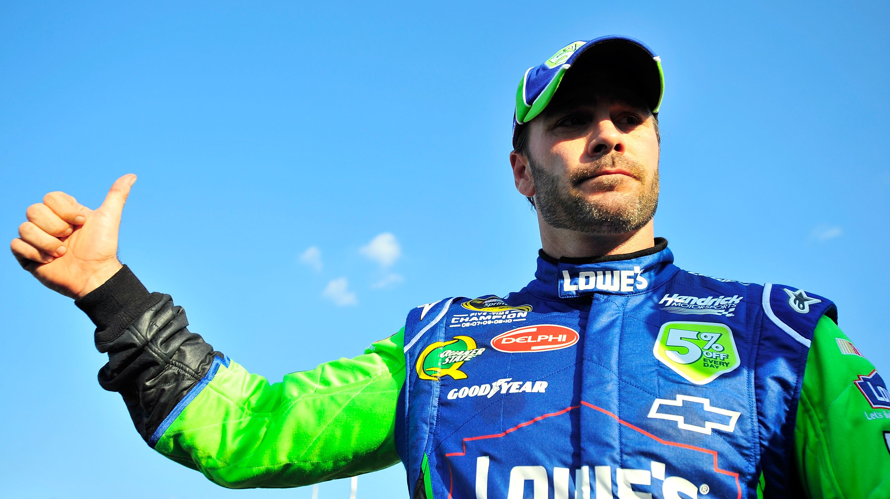 CHARLOTTE, NC - MAY 20:  Jimmie Johnson, driver of the #5 Lowe's 5% Every Day Chevrolet, stands on pit road during qualifying for the NASCAR Sprint All-Star Race at Charlotte Motor Speedway on May 20, 2011 in Charlotte, North Carolina.  (Photo by Jason Sm