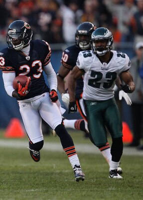 CHICAGO - NOVEMBER 28: Devin Hester #23 of the Chicago Bears breaks for a first down run of 39 yards after a catch pursued by Dimitri Patterson #23 of the Philadelphia Eagles at Soldier Field on November 28, 2010 in Chicago, Illinois. The Bears defeated t