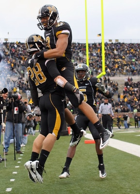 COLUMBIA, MO - NOVEMBER 13:  Wes Kemp #8  of the Missouri Tigers congratulates T.J.Moe #28 in the end zone after Moe scored a touchdown during the game against the Kansas State Wildcats on November 13, 2010 at Faurot Field/Memorial Stadium in Columbia, Mi