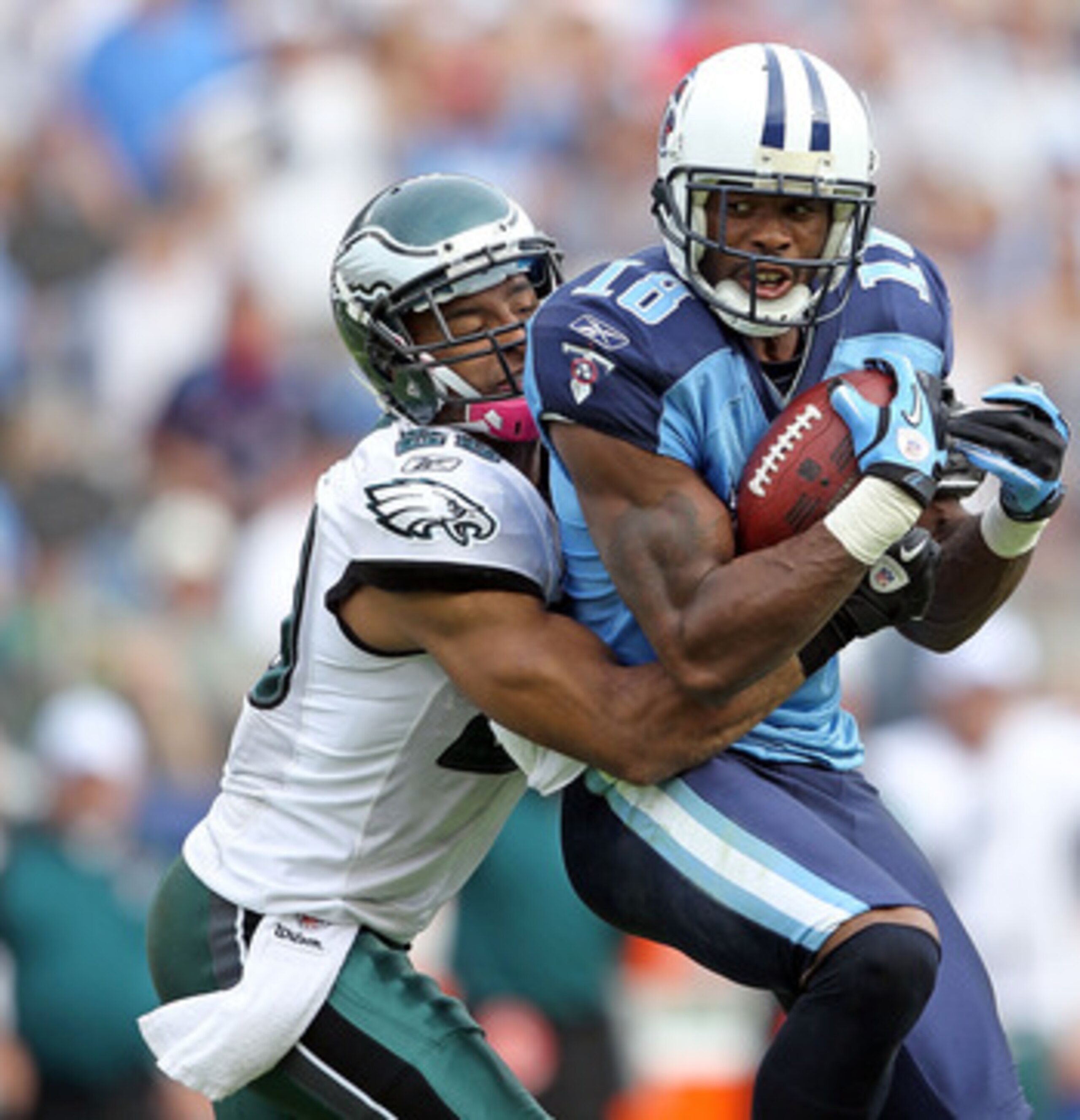 NASHVILLE, TN - OCTOBER 24:  Kenny Britt #18 of the Tennessee Titans catches a pass while defended by Nate Allen #29 of the Philadelphia Eagles during the NFL game at LP Field on October 24, 2010 in Nashville, Tennessee. The Titans won 37-19.  (Photo by A