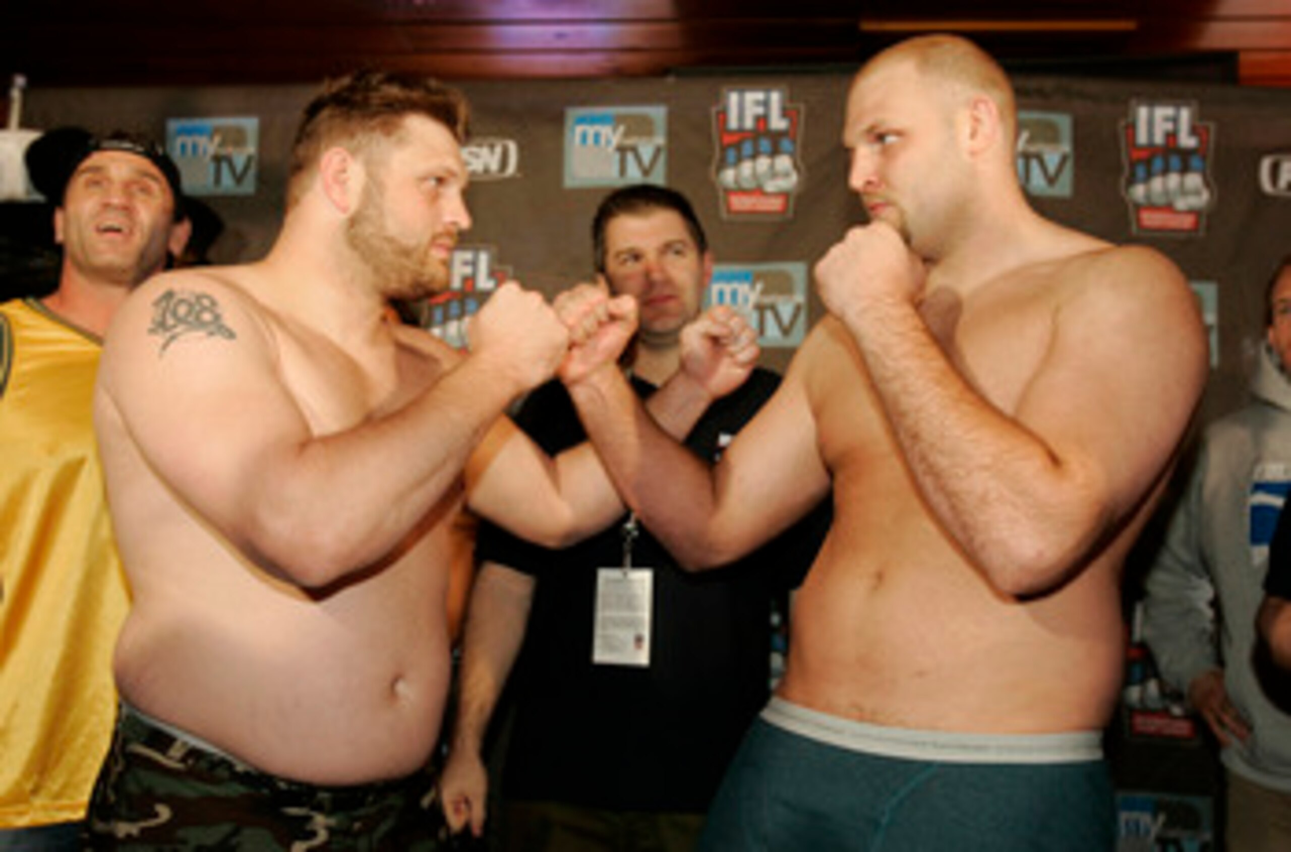 DAVENPORT, IA - APRIL 06:  Roy Nelson (R) of the Lions and Ben Rothwell of the Silverbacks face off during the IFL weigh-in on April 6, 2007 at Hooters in Davenport, Iowa.  (Photo by Brian Bahr/Getty Images)
