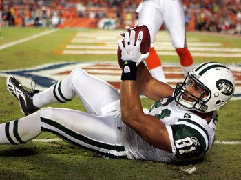 MIAMI - SEPTEMBER 26:  Tight end Dustin Keller #81  of the New York Jets catches a touchdown against  the Miami Dolphins at Sun Life Stadium on September 26, 2010 in Miami, Florida.  (Photo by Marc Serota/Getty Images)