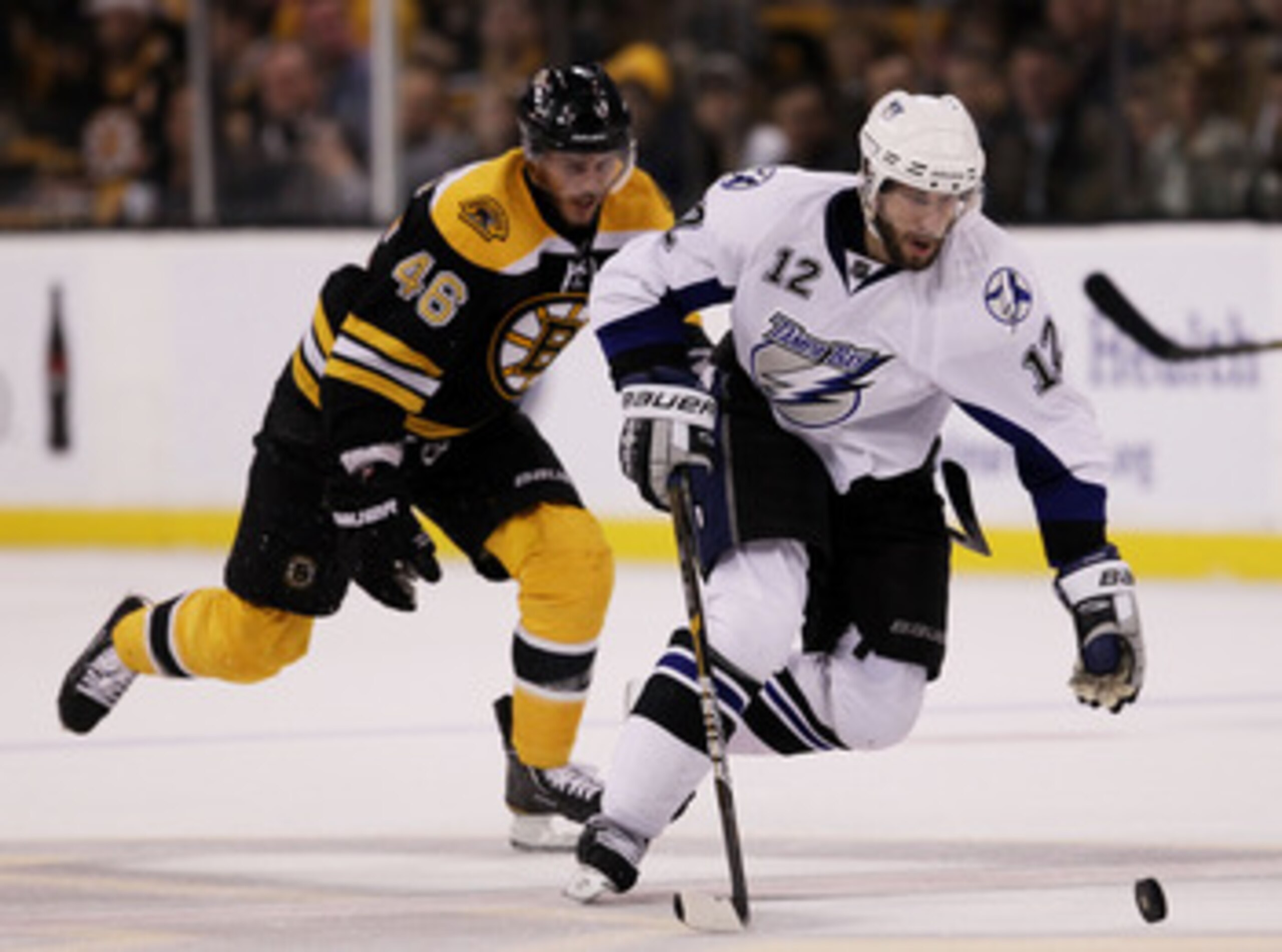 BOSTON, MA - MAY 23: Simon Gagne #12 of the Tampa Bay Lightning controls the puck against David Krejci #46 of the Boston Bruins in Game Five of the Eastern Conference Finals during the 2011 NHL Stanley Cup Playoffs at TD Garden on May 23, 2011 in Boston, BOSTON, MA - MAY 23: Simon Gagne #12 of the Tampa Bay Lightning controls the puck against David Krejci #46 of the Boston Bruins in Game Five of the Eastern Conference Finals during the 2011 NHL Stanley Cup Playoffs at TD Garden on May 23, 2011 in Boston,