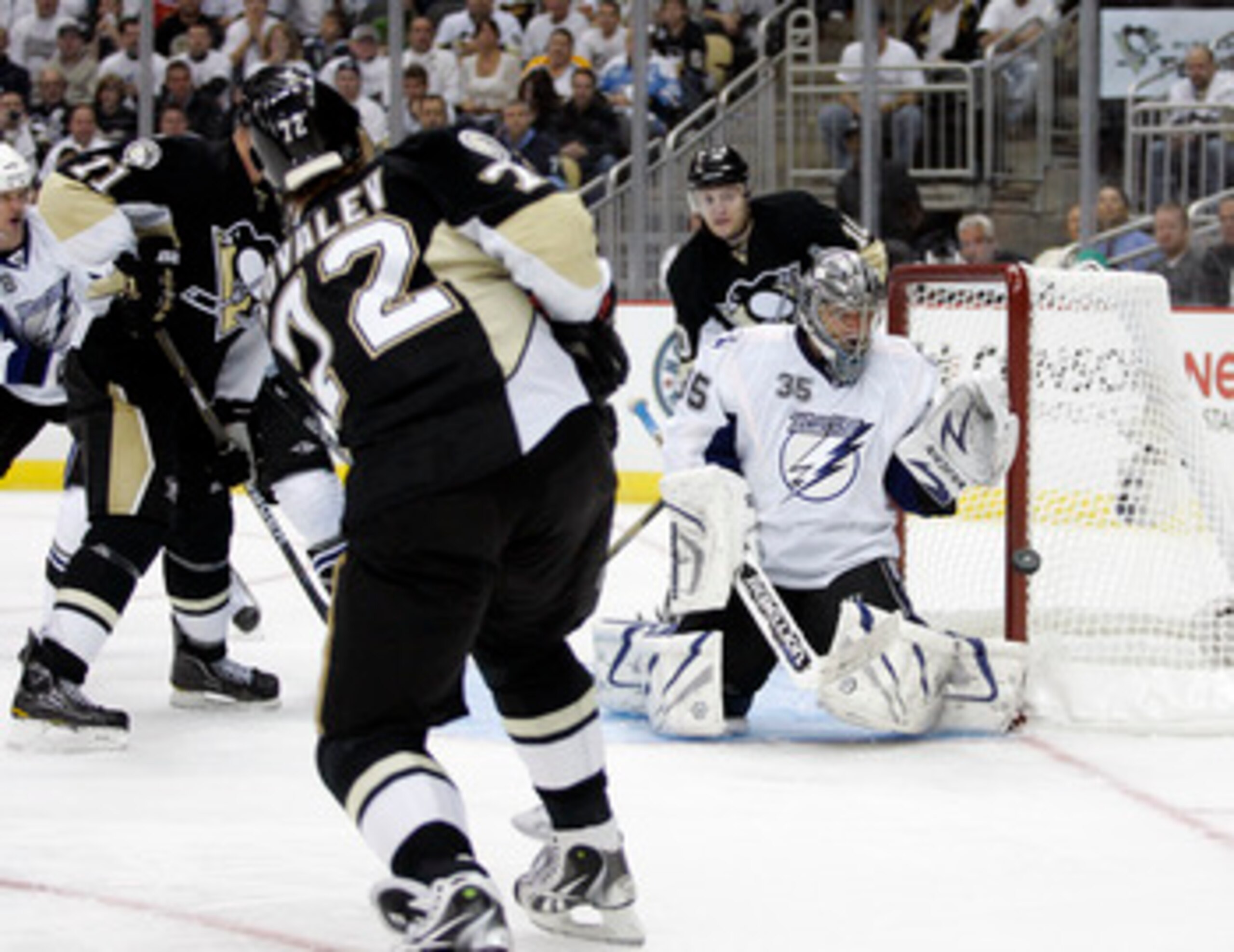 PITTSBURGH, PA - APRIL 13: Dwayne Roloson #35 of the Tampa Bay Lightning makes a glove save on Alexei Kovalev #72 of the Pittsburgh Penguins in Game One of the Eastern Conference Quarterfinals during the 2011 NHL Stanley Cup Playoffs at Consol Energy Cent PITTSBURGH, PA - APRIL 13: Dwayne Roloson #35 of the Tampa Bay Lightning makes a glove save on Alexei Kovalev #72 of the Pittsburgh Penguins in Game One of the Eastern Conference Quarterfinals during the 2011 NHL Stanley Cup Playoffs at Consol Energy Cent