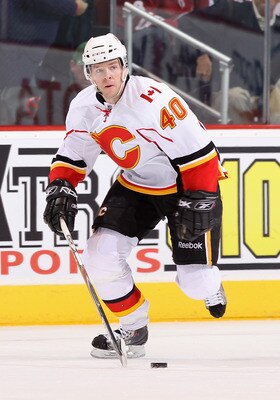 GLENDALE, AZ - MARCH 10:  Alex Tanguay #40 of the Calgary Flames skates with the puck during the NHL game against the Phoenix Coyotes at Jobing.com Arena on March 10, 2011 in Glendale, Arizona.  The Coyotes defeated the Flames 3-0.  (Photo by Christian Pe
