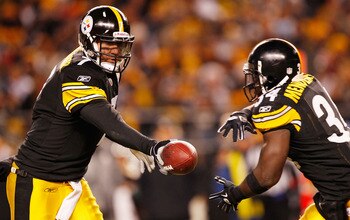 PITTSBURGH - DECEMBER 23:  Ben Roethlisberger #7 of the Pittsburgh Steelers hands the ball off to teammate Rashard Mendenhall #34 during the game against  the Carolina Panthers on December 23, 2010 at Heinz Field in Pittsburgh, Pennsylvania.  (Photo by Ja