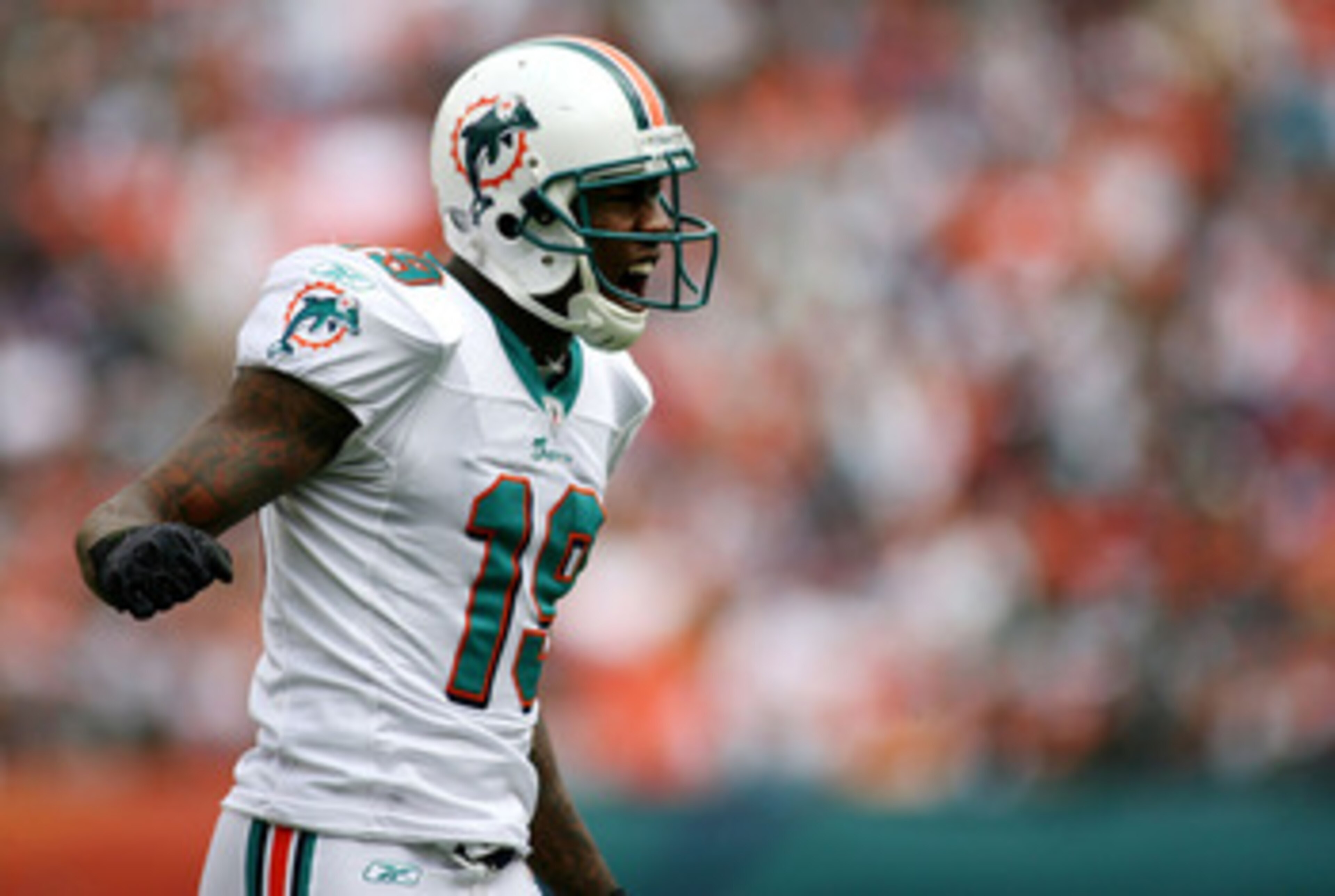 MIAMI - DECEMBER 19:  Receiver Brandon Marshall #19 of the Miami Dolphins reacts against the Buffalo Bills at Sun Life Stadium on December 19, 2010 in Miami, Florida. The Bills defeated the Dolphins 17-14.  (Photo by Marc Serota/Getty Images)