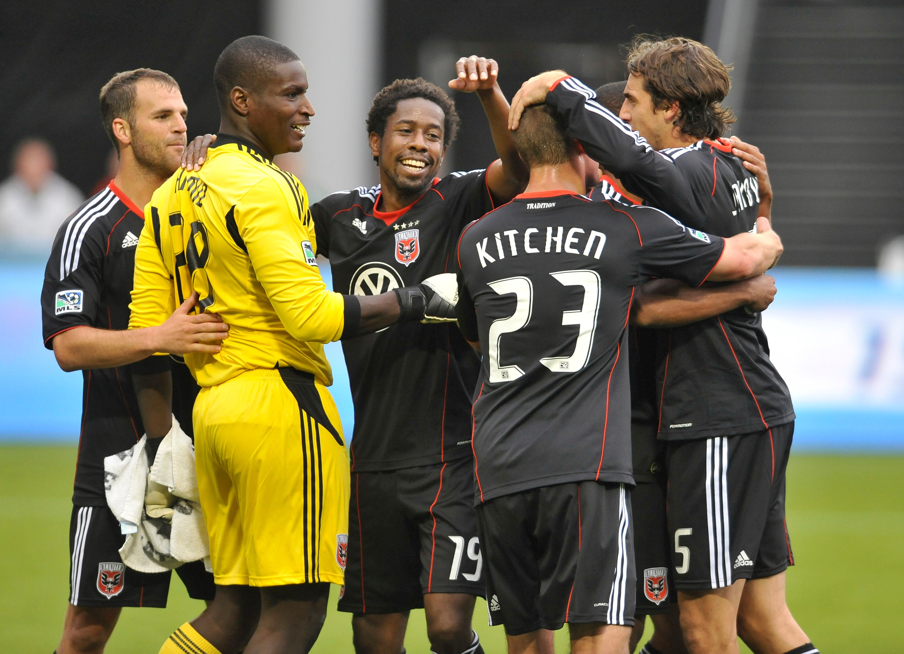 PORTLAND, OR - MAY 29: Goalie Bill Hamid #28, Clyde Simms #19, Perry Kitchen #23 and Dejan Jakovic #5 of D.C. United hug after the game against the Portland Timbers at PGE Park on May 29, 2011 in Portland, Oregon. DC United won the game 3-2.(Photo by Stev