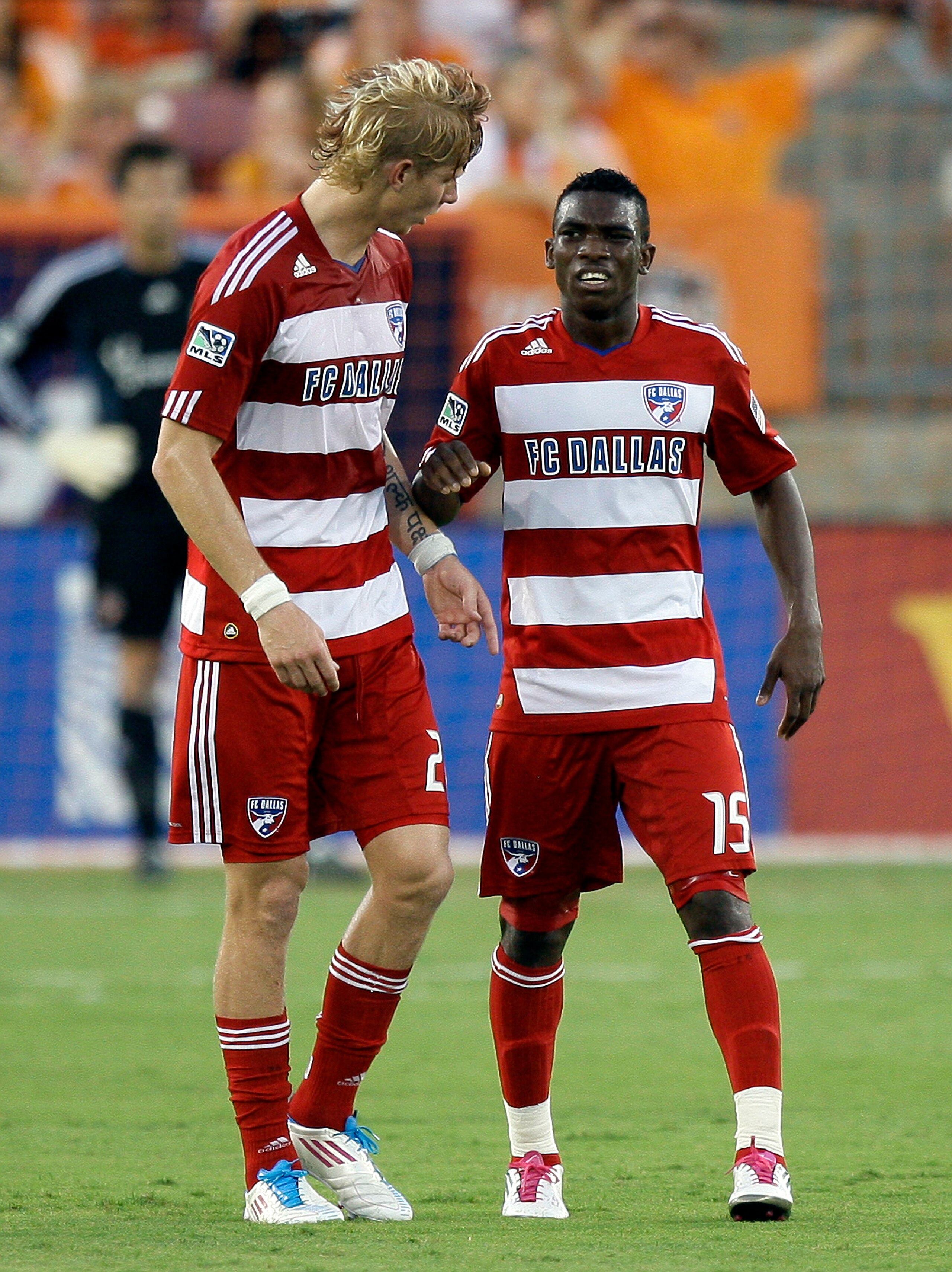 HOUSTON - MAY 28:  Forward Fabian Castillo #15 of FC Dallas is checked on by Brek Shea #20 after he comes up hobbling in the first half against the Houston Dynamo at Robertson Stadium on May 28, 2011 in Houston, Texas.  (Photo by Bob Levey/Getty Images)