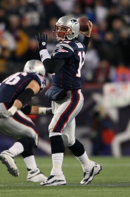 FOXBORO, MA - JANUARY 16:  Quarterback Tom Brady #12 of the New England Patriots throws a pass during their 2011 AFC divisional playoff game against the New York Jets at Gillette Stadium on January 16, 2011 in Foxboro, Massachusetts.  (Photo by Elsa/Getty