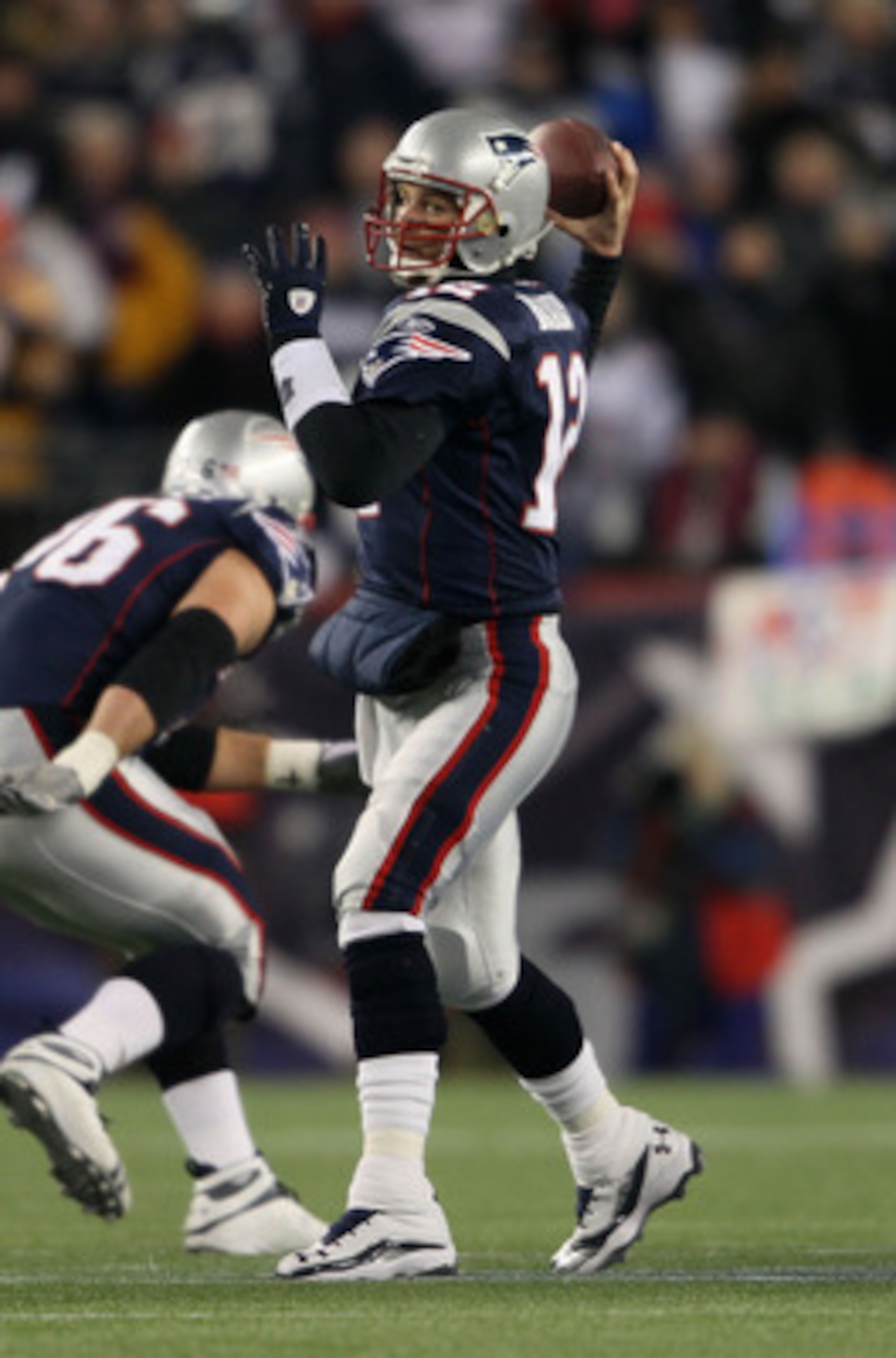 FOXBORO, MA - JANUARY 16:  Quarterback Tom Brady #12 of the New England Patriots throws a pass during their 2011 AFC divisional playoff game against the New York Jets at Gillette Stadium on January 16, 2011 in Foxboro, Massachusetts.  (Photo by Elsa/Getty