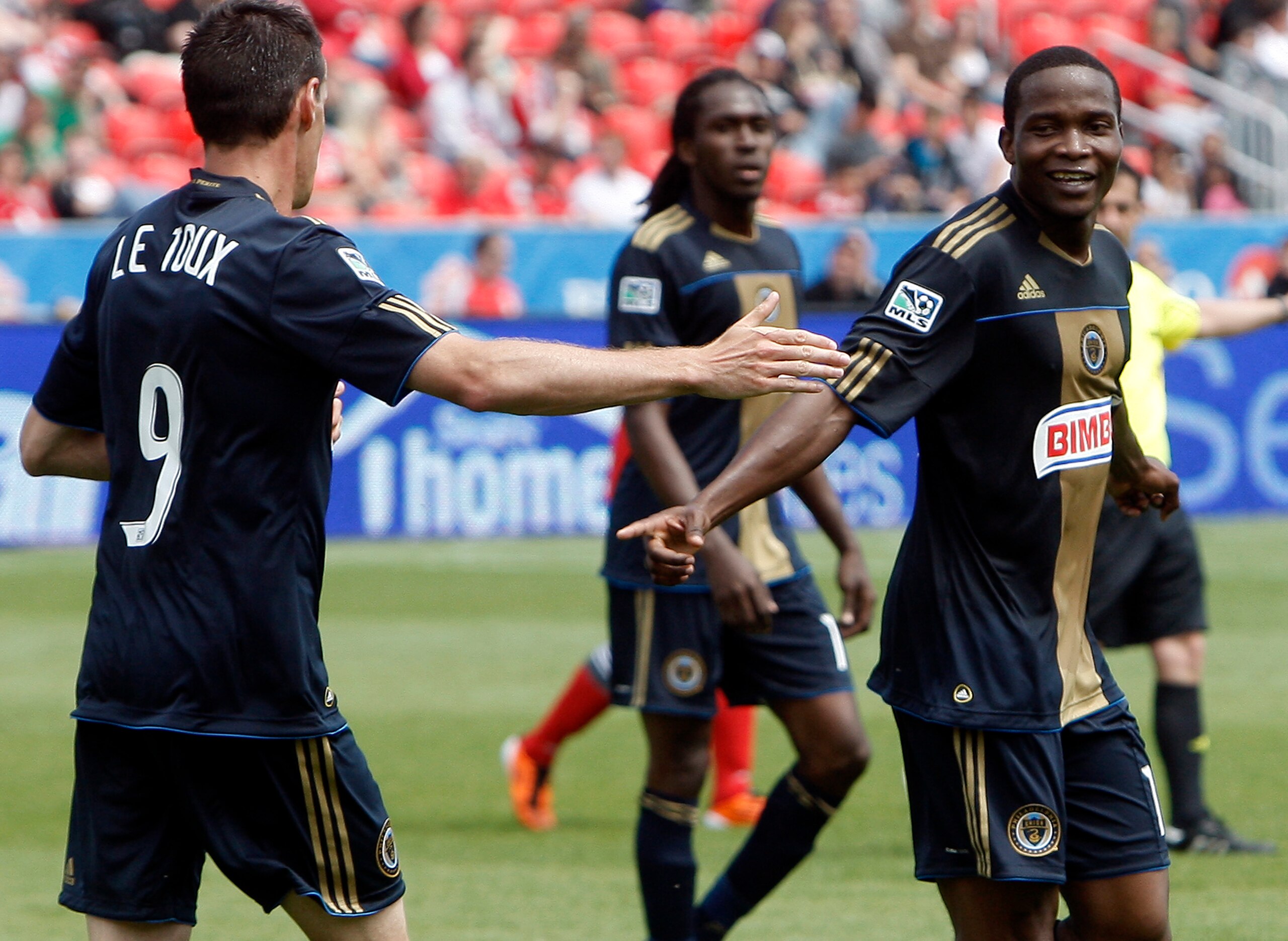 TORONTO, CANADA - MAY 28: Sebastien Le Toux #9 and Danny Mwanga #10 of Philadelphia Union celebrate Danny Mwanga goal against Toronto FC during MLS action at BMO Field May 28, 2011 in Toronto, Ontario, Canada. (Photo by Abelimages/Getty Images)