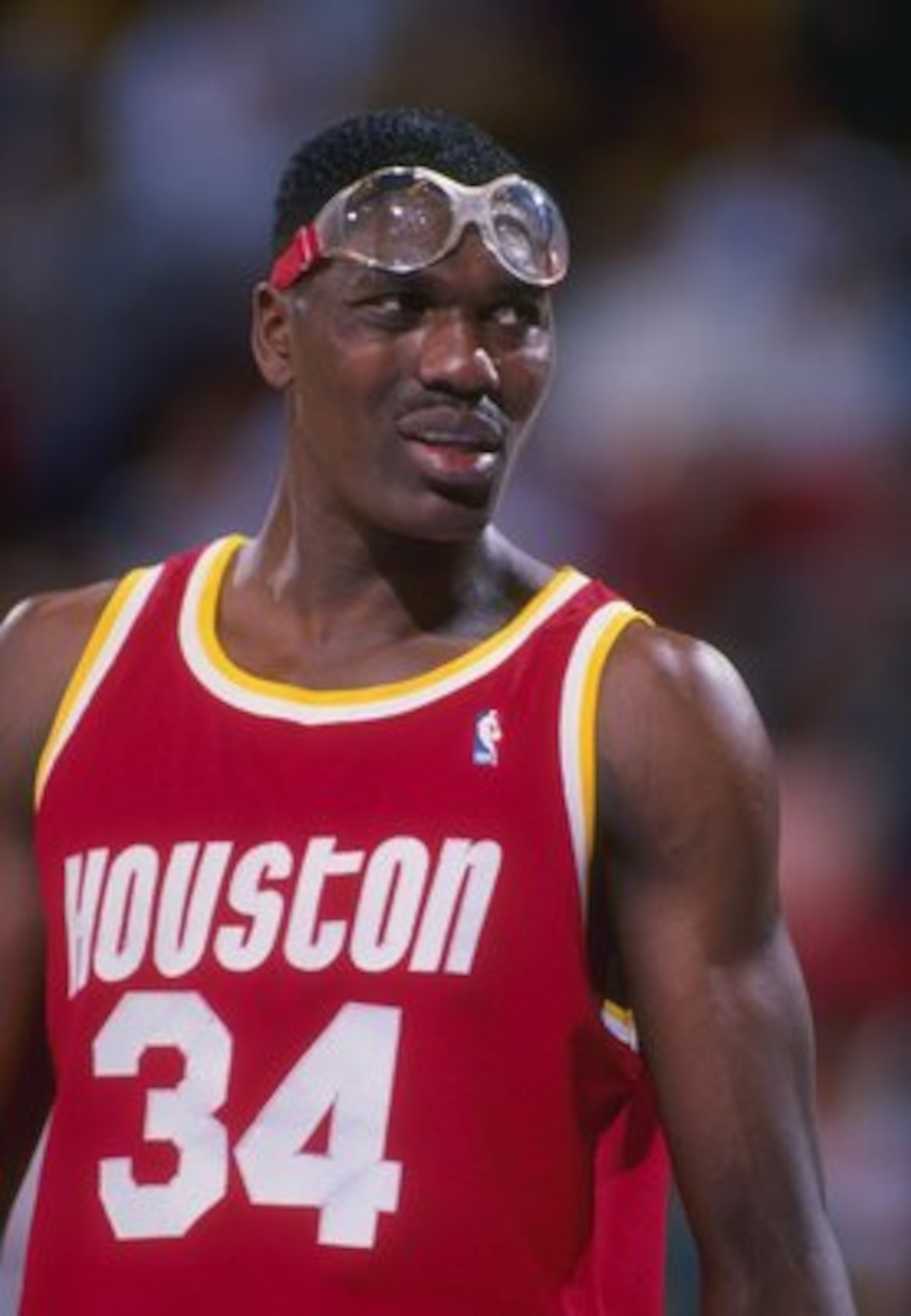 Center Hakeem Olajuwon of the Houston Rockets looks on.