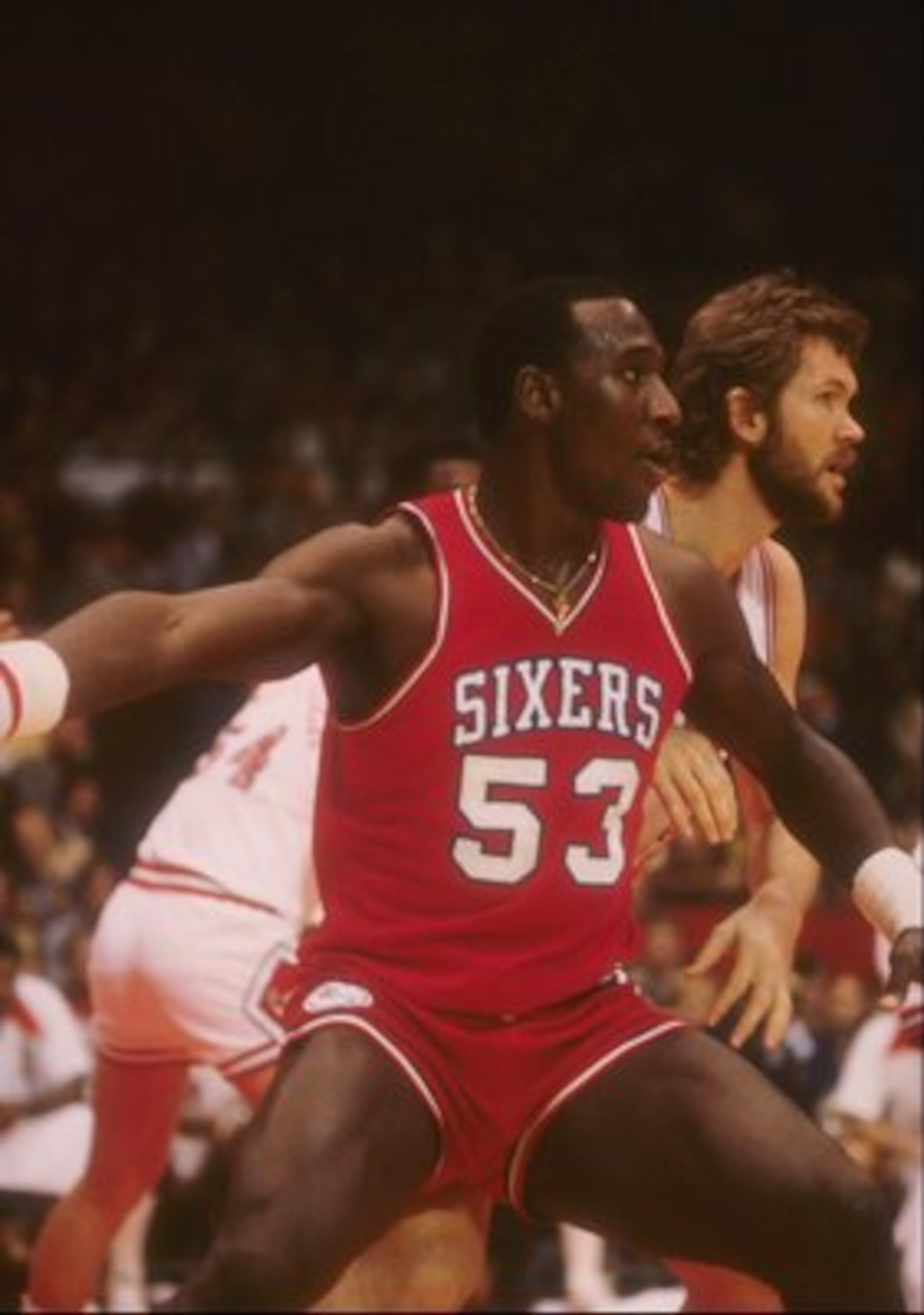 Darryl Dawkins of the Philadelphia 76ers looks on during a game. Darryl Dawkins of the Philadelphia 76ers looks on during a game.