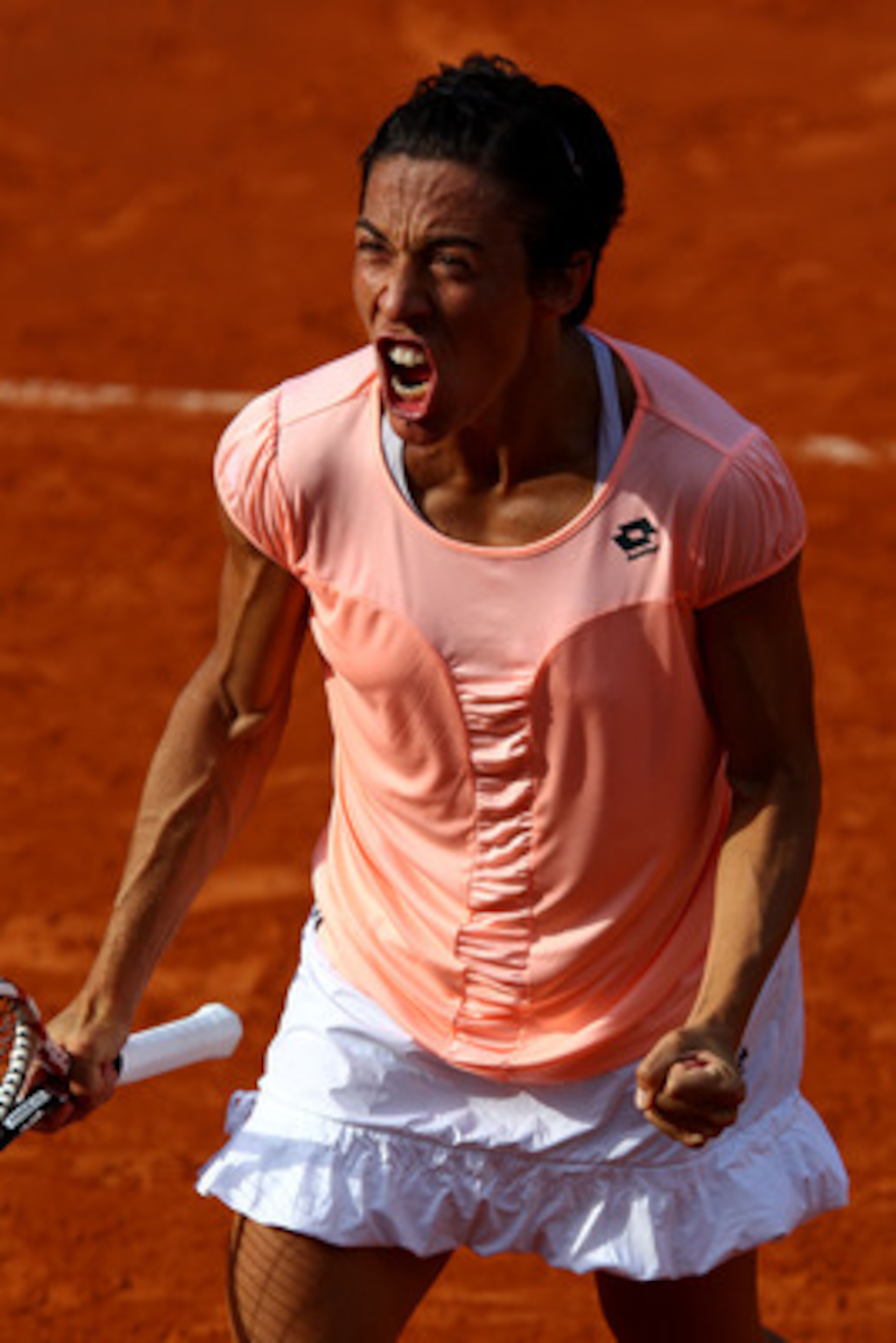 PARIS, FRANCE - MAY 29:  Francesca Schiavone of Italy celebrates match point after the women's singles round four match between Jelena Jankovic of Serbia and Francesca Schiavone of Italy on day eight of the French Open at Roland Garros on May 29, 2011 in