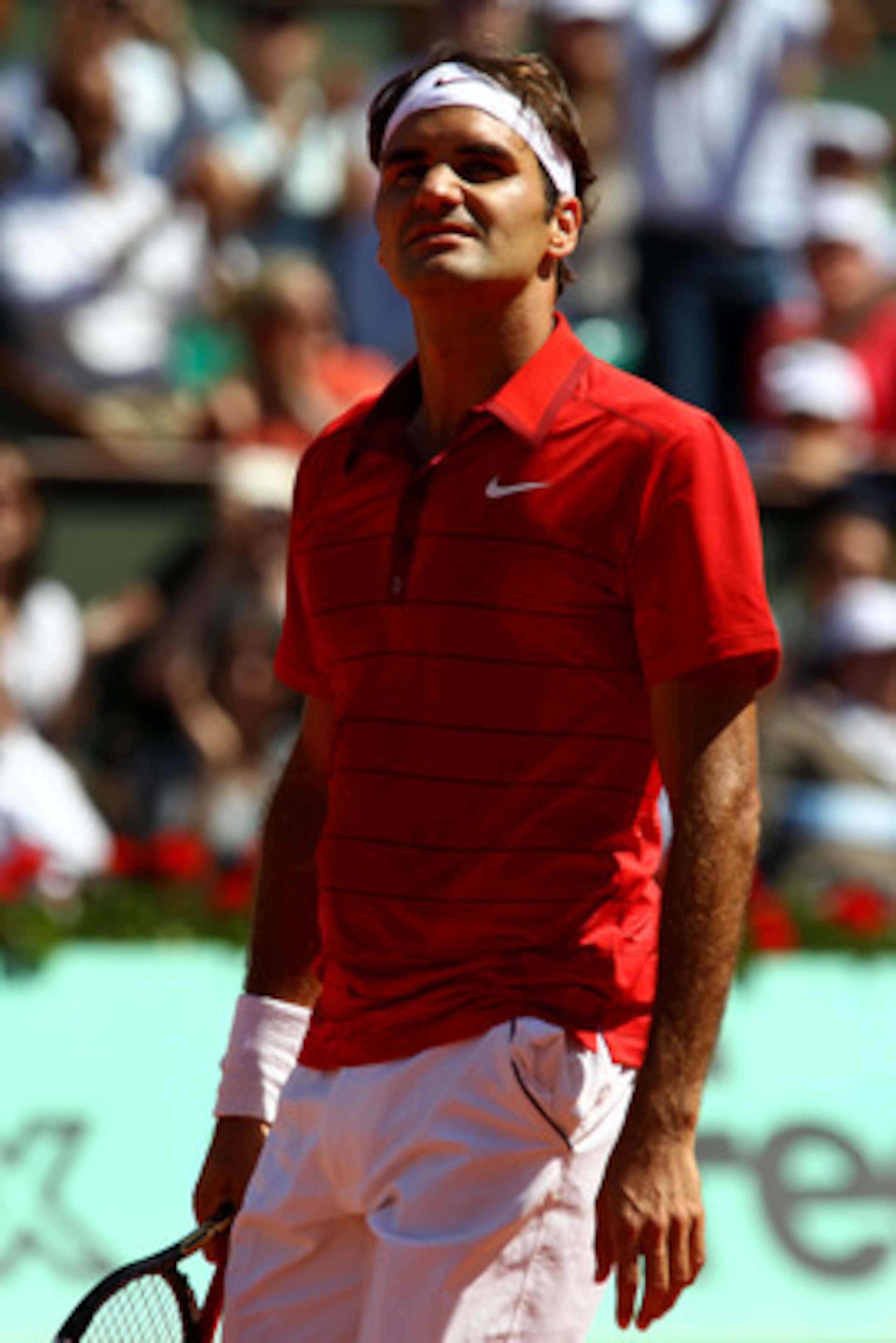 PARIS, FRANCE - MAY 29:  Roger Federer of Switzerland looks up to the crowd during the men's singles round four match between Stanislas Wawrinka of Switzerland and Roger Federer of Switzerland on day eight of the French Open at Roland Garros on May 29, 20