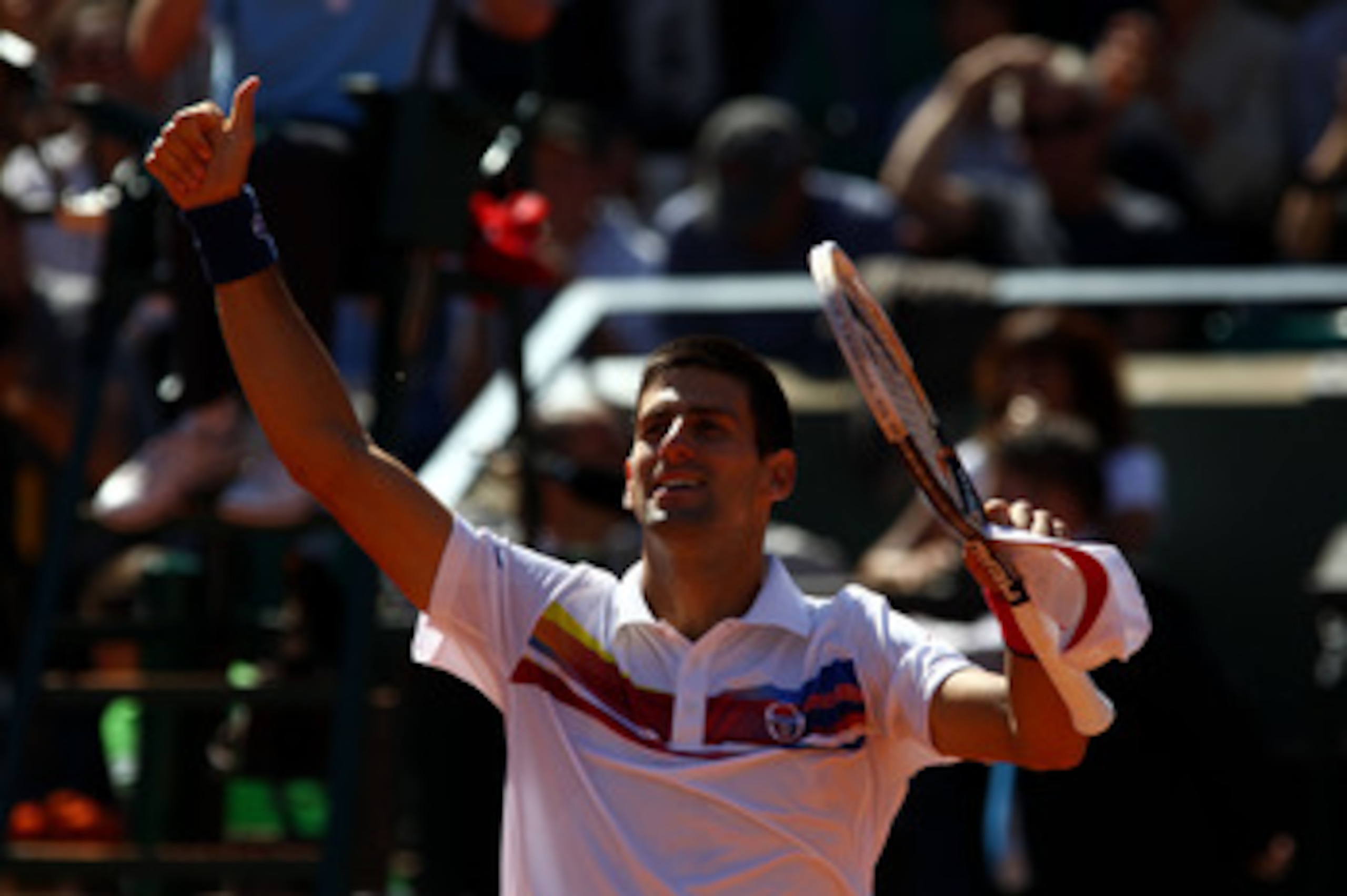 PARIS, FRANCE - MAY 28:  Novak Djokovic of Serbia
salutes the crowd as he celebrates match point during the men's singles round three match between Juan Martin Del Potro of Argentina and Novak Djokovic of Serbia on day seven of the French Open at Roland G