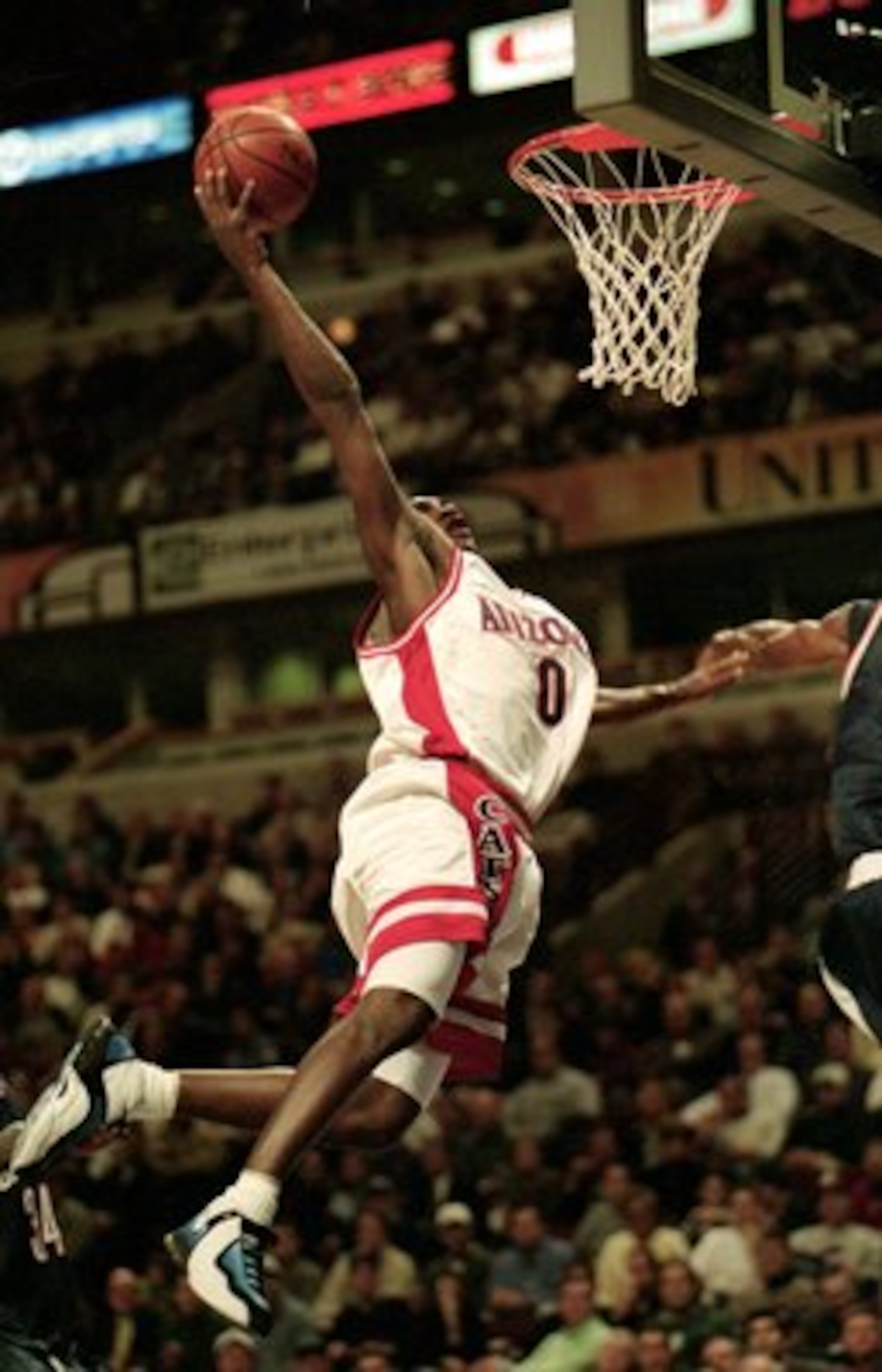 7 Dec 1999:  Gilbert Arenas #0 of the Arizona Wildcats makes a slam dunk during a game against the Connecticut Huskies  at the United Center in Chicago, Illinois. The Huskies defeated the Wildcats 78-69. Mandatory Credit: Kathleen Economou  /Allsport