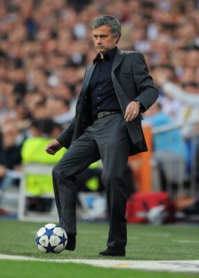 MADRID, SPAIN - APRIL 27:  Head coach Jose Mourinho of Real Madrid strikes the ball during the UEFA Champions League Semi Final first leg match between Real Madrid and Barcelona at the Estadio Santiago Bernabeu on April 27, 2011 in Madrid, Spain.  (Photo