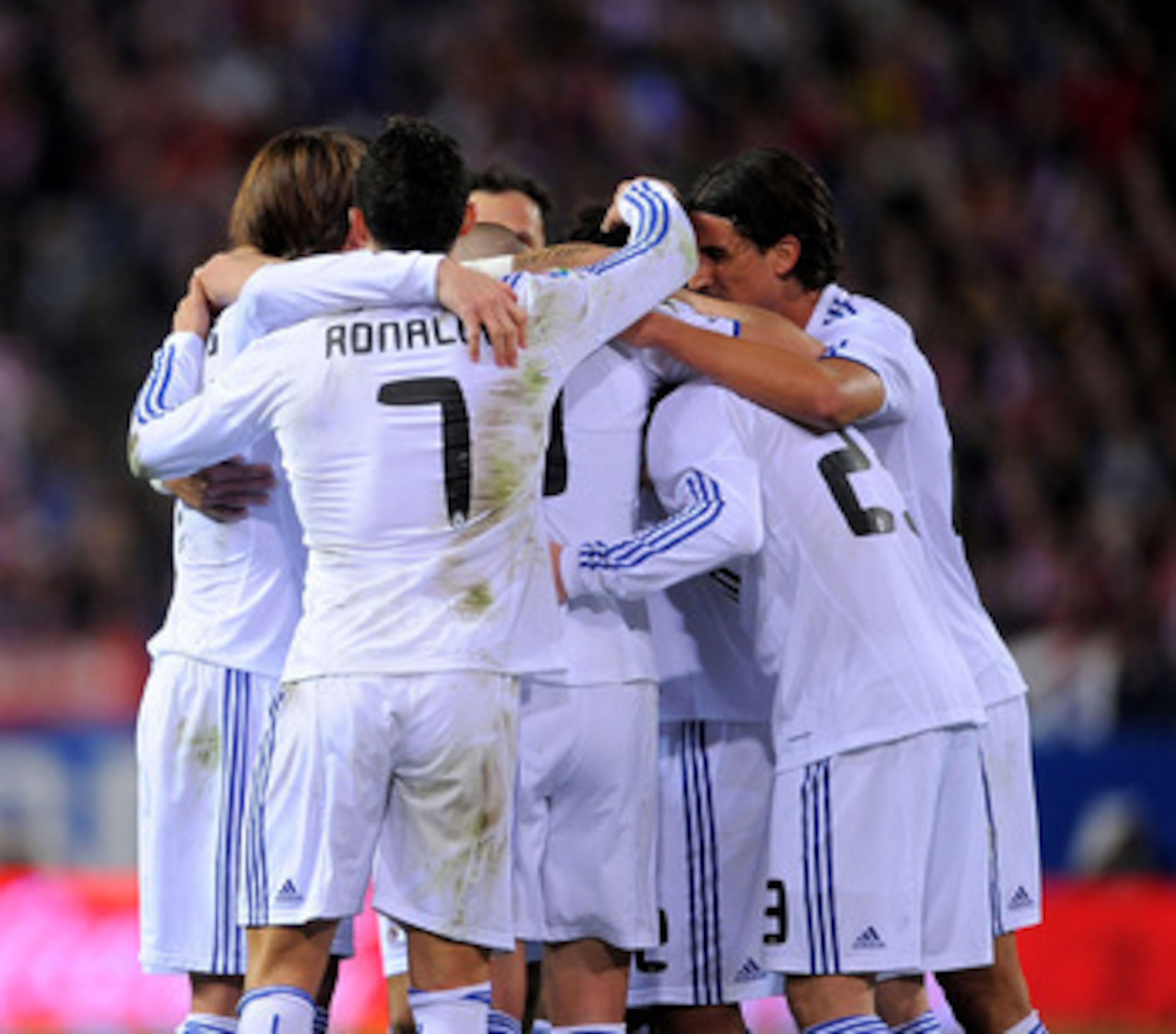 MADRID, SPAIN - MARCH 19: Cristiano Ronaldo celebrates with team mates after Mesut Ozil scored their scored goal during the La Liga match between Atletico Madrid and Real Madrid at Vicente Calderon Stadium on March 19, 2011 in Madrid, Spain. (Photo by De MADRID, SPAIN - MARCH 19: Cristiano Ronaldo celebrates with team mates after Mesut Ozil scored their scored goal during the La Liga match between Atletico Madrid and Real Madrid at Vicente Calderon Stadium on March 19, 2011 in Madrid, Spain. (Photo by De