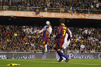 VALENCIA, SPAIN - APRIL 20:  Cristiano Ronaldo of Real Madrid (R) scores the winning goal during the Copa del Rey Final between Real Madrid and Barcelona at Estadio Mestalla on April 20, 2011 in Valencia, Spain. Real Madrid won 1-0.  (Photo by David Ramos