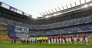 MADRID, SPAIN - APRIL 27:  Players from Real Madrid and Barcelona line up prior to the UEFA Champions League Semi Final first leg match between Real Madrid and Barcelona at Estadio Santiago Bernabeu on April 27, 2011 in Madrid, Spain.  (Photo by Alex Live