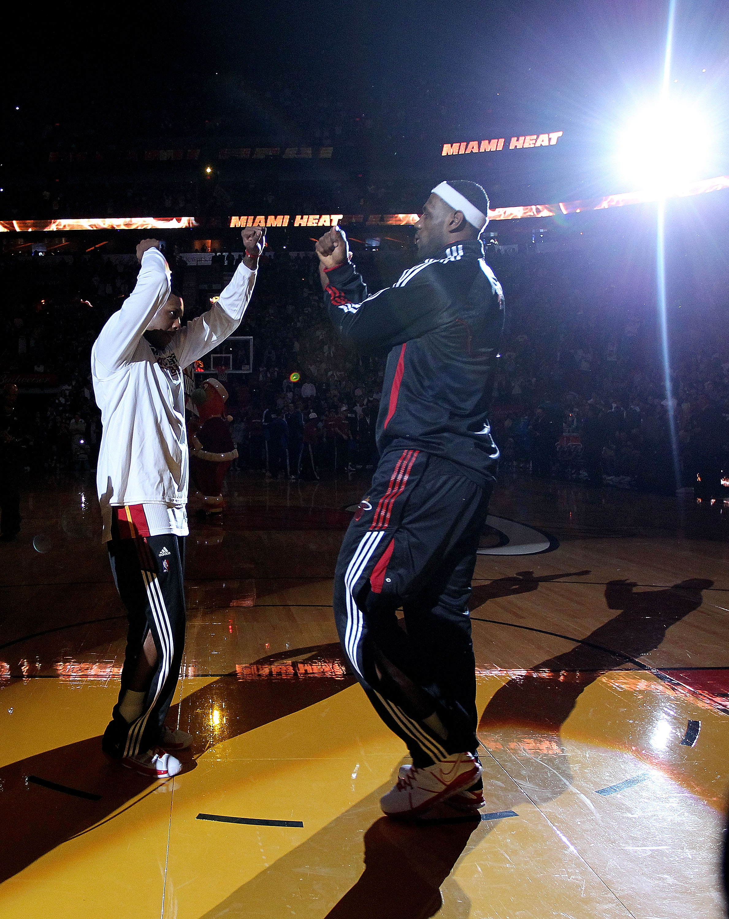MIAMI, FL - DECEMBER 20:  LeBron James #6 of the Miami Heat high fives Mario Chalmers during a game against the Dallas Mavericks at American Airlines Arena on December 20, 2010 in Miami, Florida. NOTE TO USER: User expressly acknowledges and agrees that,