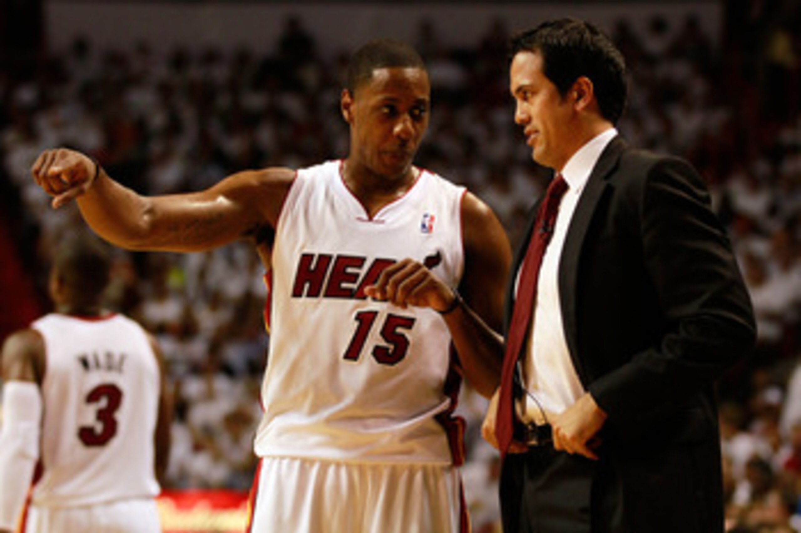 MIAMI, FL - MAY 24:  Head coach Erik Spoelstra of the Miami Heat talks with Mario Chalmers #15 against the Chicago Bulls in Game Four of the Eastern Conference Finals during the 2011 NBA Playoffs on May 24, 2011 at American Airlines Arena in Miami, Florid