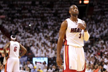 MIAMI, FL - MAY 24:  Dwyane Wade #3 of the Miami Heat looks on as LeBron James #6 stands in the background against the Chicago Bulls in Game Four of the Eastern Conference Finals during the 2011 NBA Playoffs on May 24, 2011 at American Airlines Arena in M