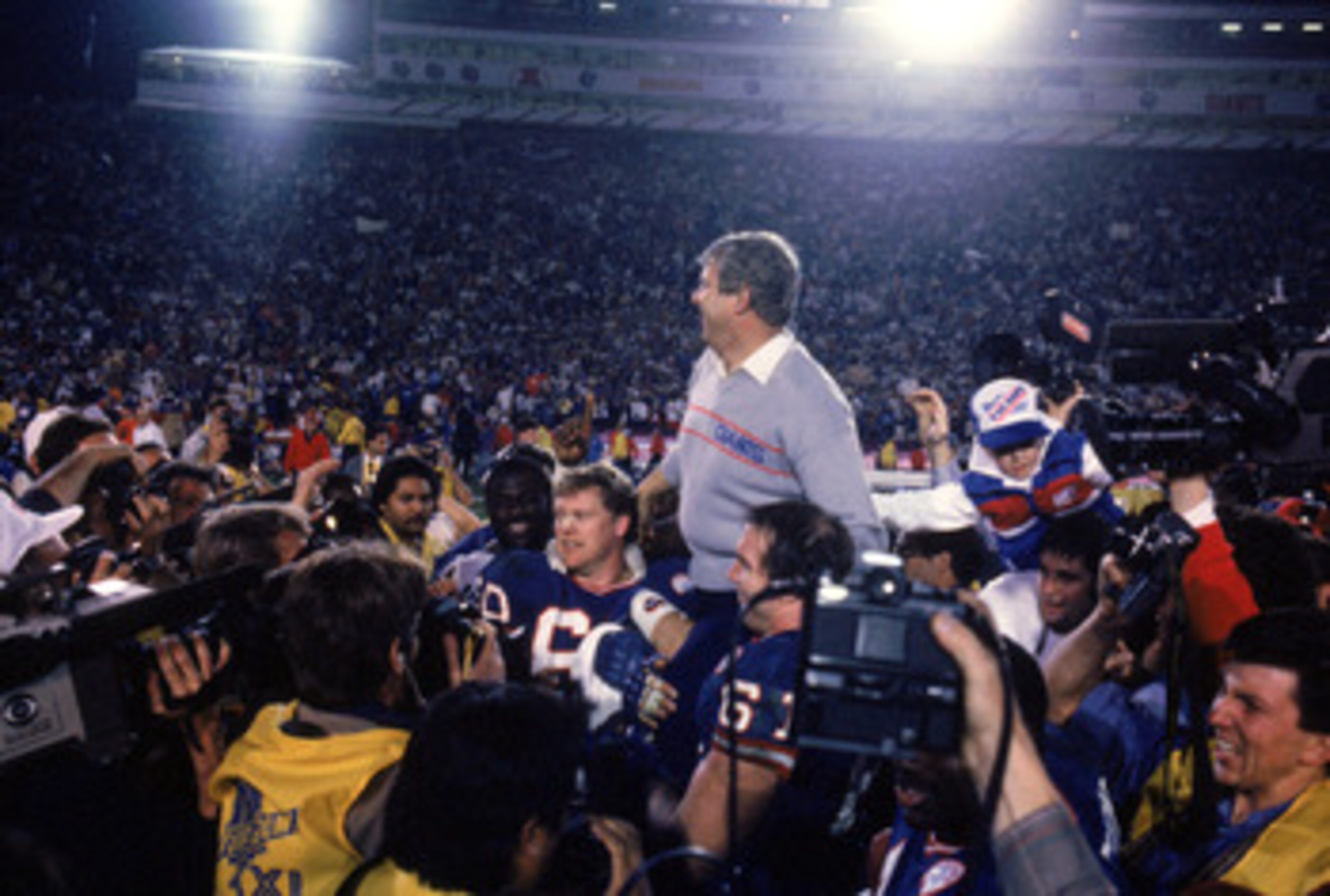 PASADENA, CA - JANUARY 25:  Head coach Bill Parcells of the New York Giants gets carried off the field following the game against the Denver Broncos during Super Bowl XXI at the Rose Bowl on January 25, 1987 in Pasadena, California. The Giants defeated th
