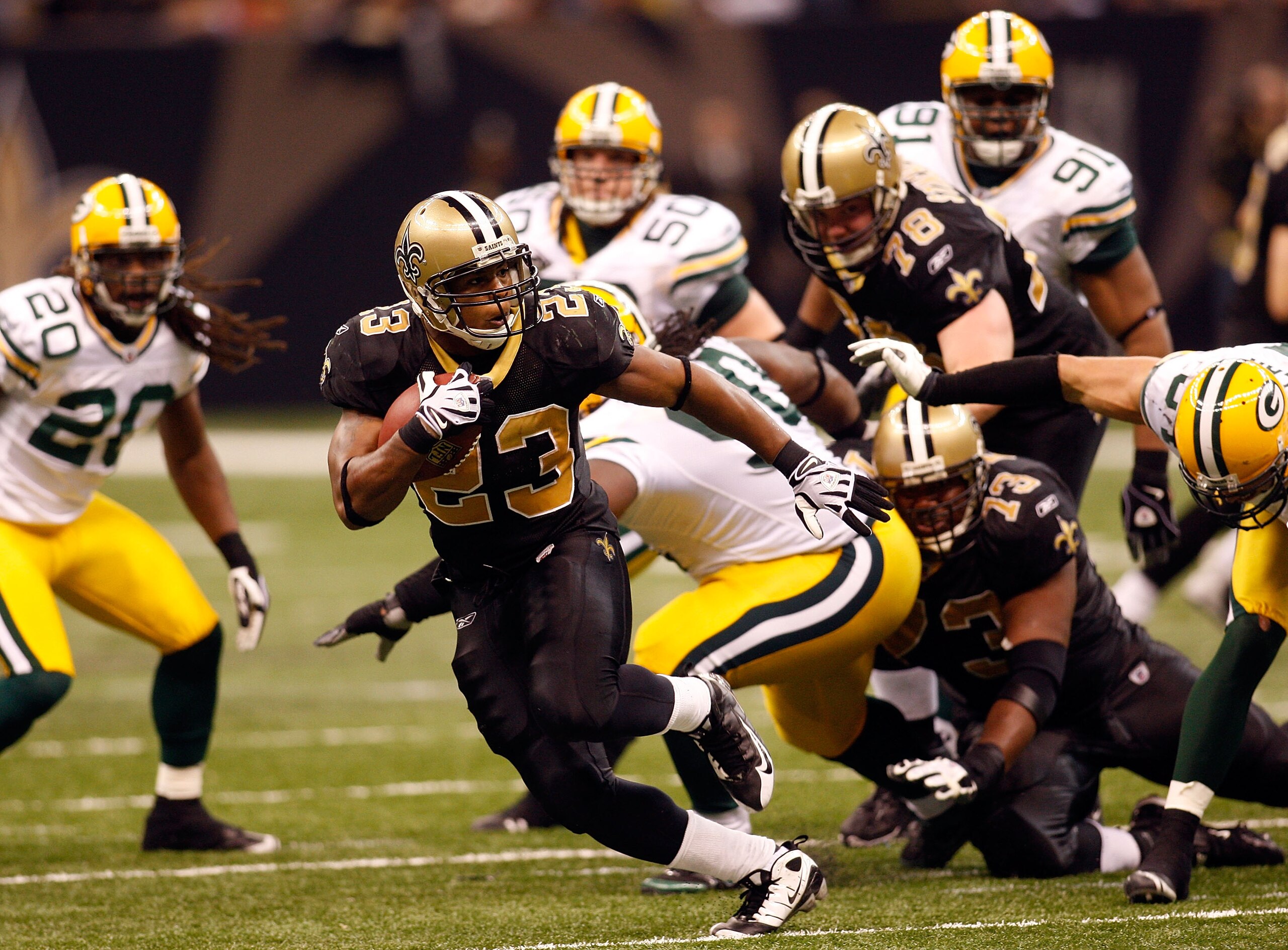 NEW ORLEANS - NOVEMBER 24: Pierre Thomas #23 of the New Orleans Saints runs 31 yards for a touchdown in the fourth quarter against the Green Bay Packers on November 24, 2009 at the Superdome in New Orleans, Louisiana. (Photo by Chris Graythen/Getty Ima NEW ORLEANS - NOVEMBER 24: Pierre Thomas #23 of the New Orleans Saints runs 31 yards for a touchdown in the fourth quarter against the Green Bay Packers on November 24, 2009 at the Superdome in New Orleans, Louisiana. (Photo by Chris Graythen/Getty Ima