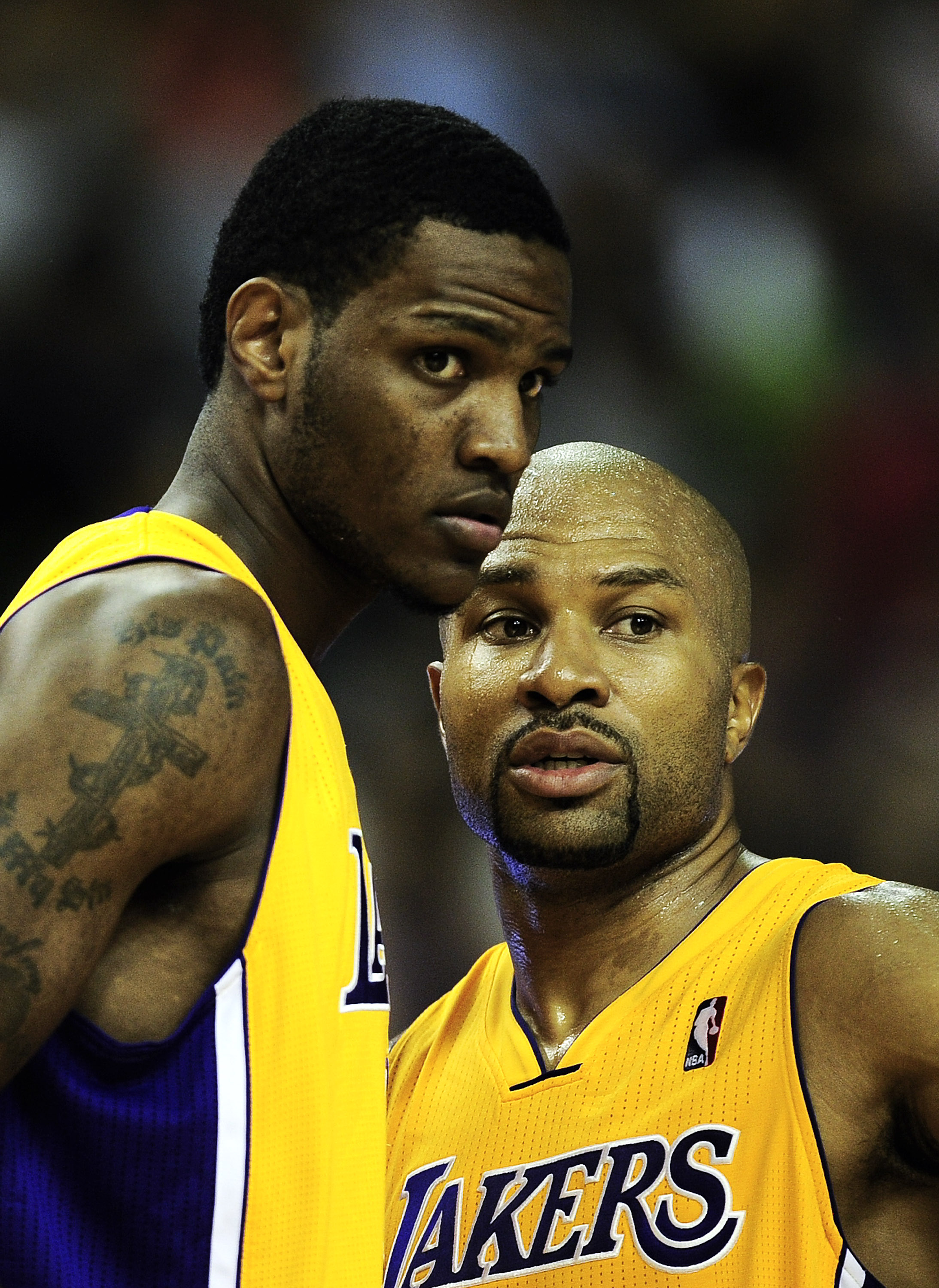 BARCELONA, SPAIN - OCTOBER 07:  Devin Ebanks #3 (L) of the Los Angeles Lakers and his teammate Derek Fisher #2 chat during the NBA Europe Live match between Los Angeles Lakers and Regal FC Barcelona at the at Palau Blaugrana on October 7, 2010 in Barcelon