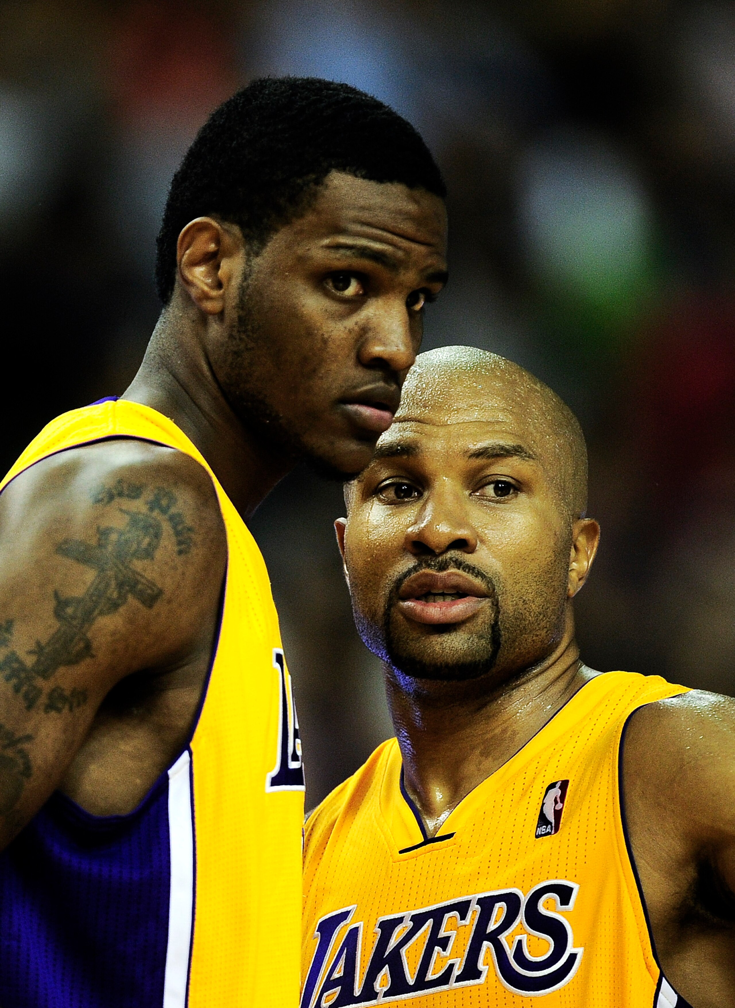 BARCELONA, SPAIN - OCTOBER 07:  Devin Ebanks #3 (L) of the Los Angeles Lakers and his teammate Derek Fisher #2 chat during the NBA Europe Live match between Los Angeles Lakers and Regal FC Barcelona at the at Palau Blaugrana on October 7, 2010 in Barcelon