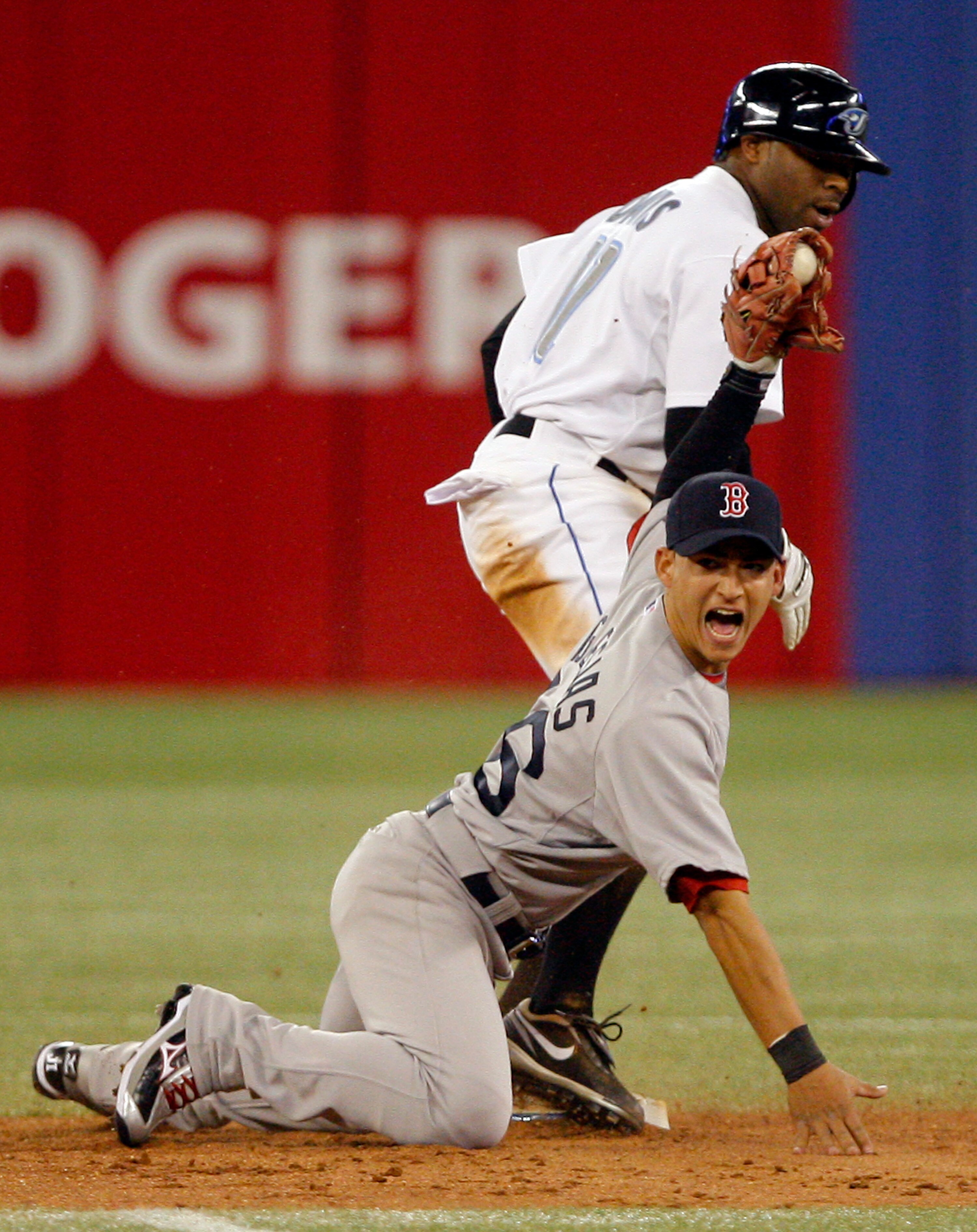 TORONTO, CANADA - MAY 10: Rajai Davis #11 of the Toronto Blue Jays steals second on Jose Iglesias #76 of the Boston Red Sox during MLB action at the Rogers Centre May 10, 2011 in Toronto, Ontario, Canada. (Photo by Abelimages/Getty Images)