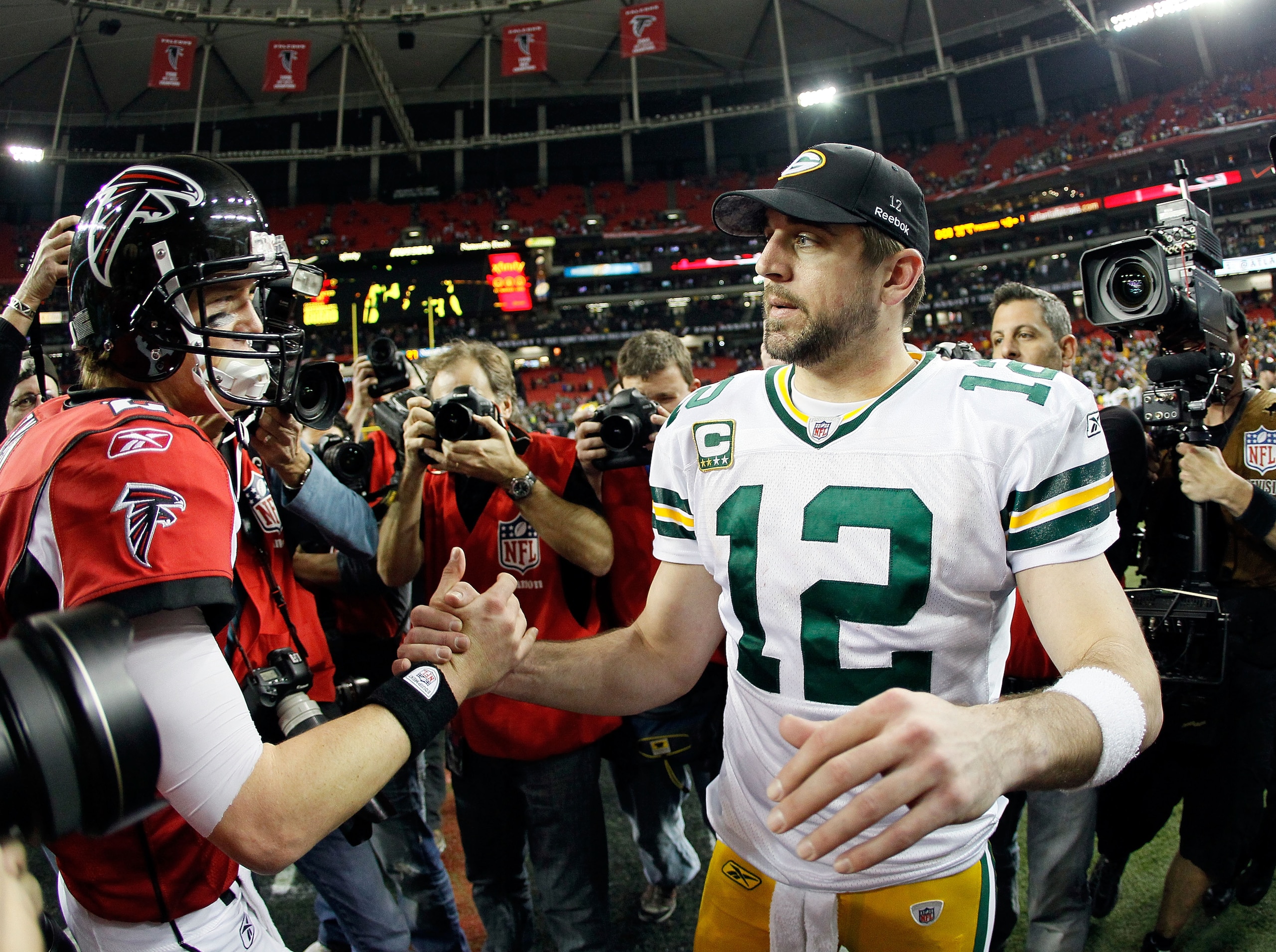 ATLANTA, GA - JANUARY 15: Quarterback Aaron Rodgers #12 (R) of the Green Bay Packers is congratulated by Matt Ryan #2 of the Atlanta Falcons after the Packers won 48-21 during their 2011 NFC divisional playoff game at Georgia Dome on January 15, 2011 in ATLANTA, GA - JANUARY 15: Quarterback Aaron Rodgers #12 (R) of the Green Bay Packers is congratulated by Matt Ryan #2 of the Atlanta Falcons after the Packers won 48-21 during their 2011 NFC divisional playoff game at Georgia Dome on January 15, 2011 in