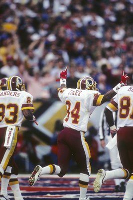 SAN DIEGO - JANUARY 31:  Wide receiver Gary Clark #84 (C) of the Washington Redskins celebrates his touchdown during Super Bowl XXII against the Denver Broncos at Jack Murphy Stadium on January 31, 1988 in San Diego, California.  The Redskins won 42-10.