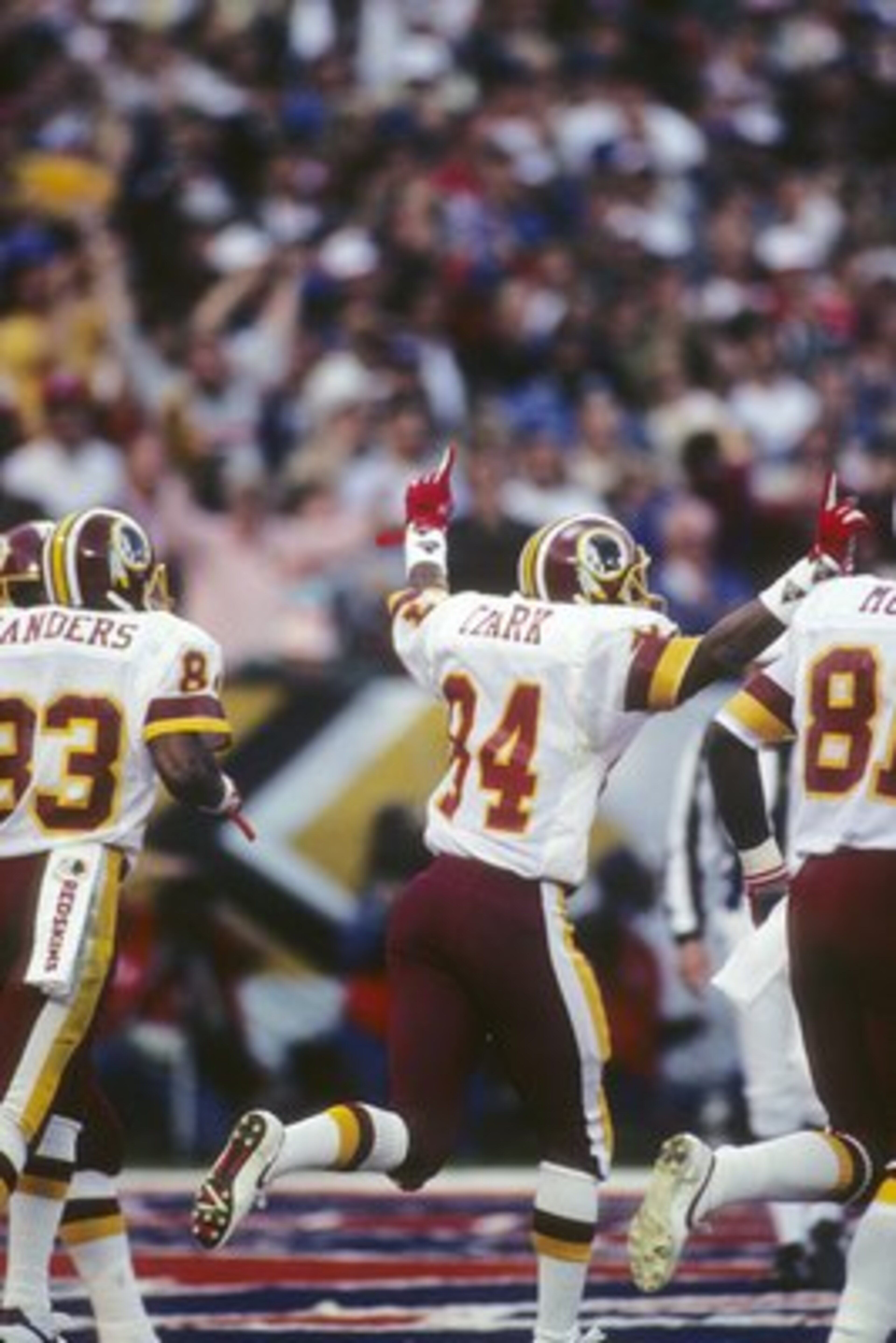 SAN DIEGO - JANUARY 31:  Wide receiver Gary Clark #84 (C) of the Washington Redskins celebrates his touchdown during Super Bowl XXII against the Denver Broncos at Jack Murphy Stadium on January 31, 1988 in San Diego, California.  The Redskins won 42-10.