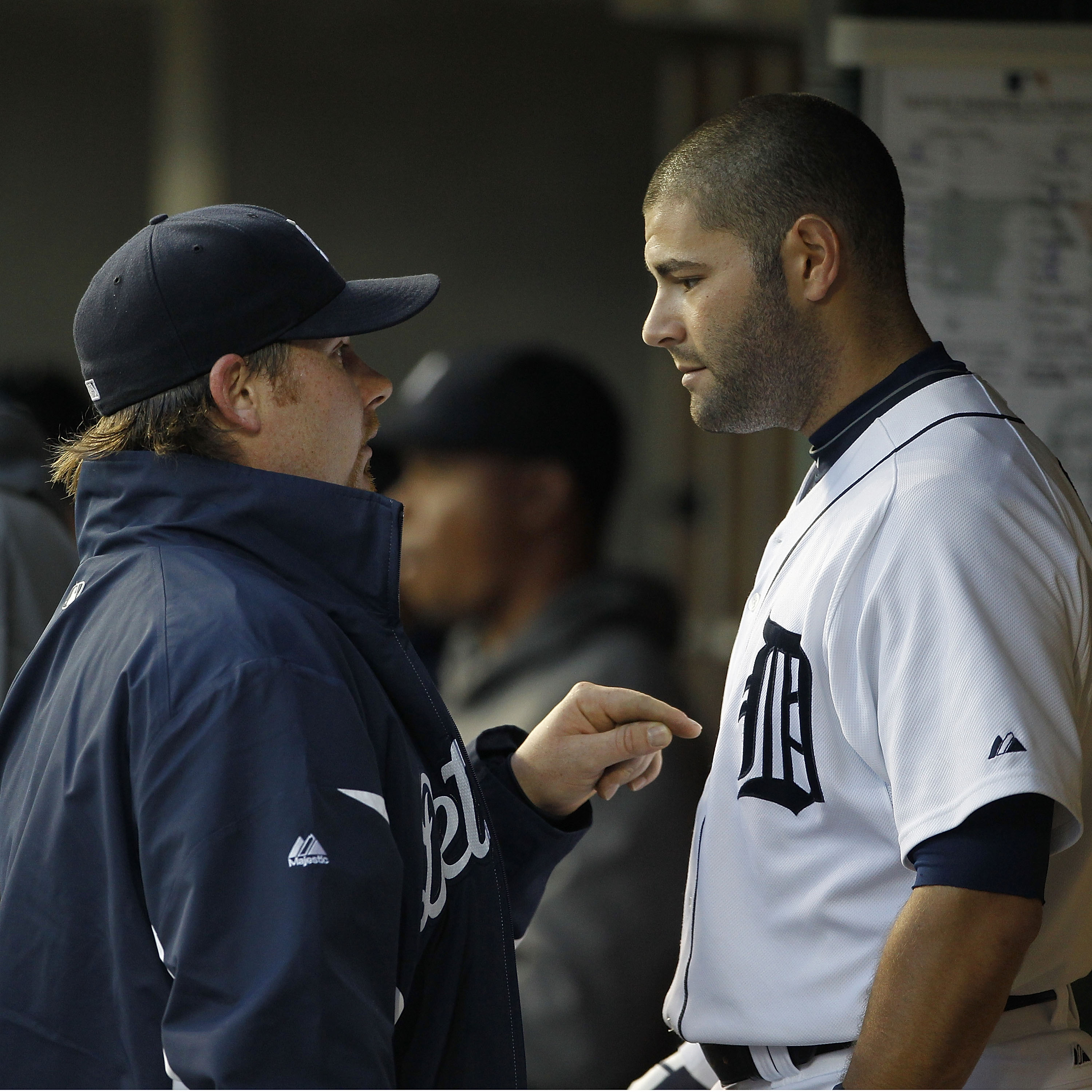 DETROIT - APRIL 26: Phil Coke #40 and Alex Avila #13 of the Detroit Tigers talk in the dugout during the game against the Seattle Mariners at Comerica Park on April 26, 2011 in Detroit, Michigan. The Mariners defeated the Tigers 7-3.  (Photo by Leon Halip