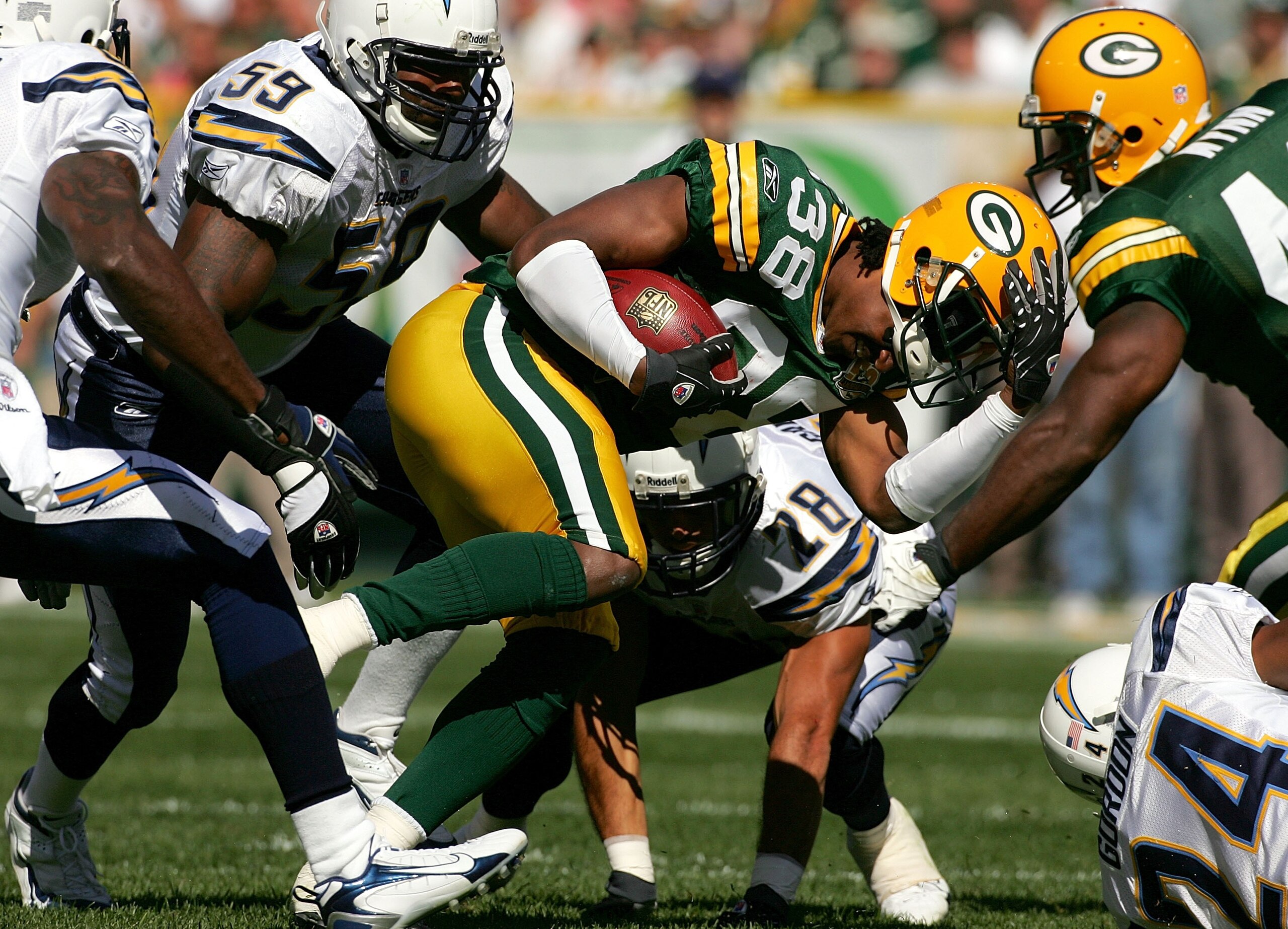 GREEN BAY, WI - SEPTEMBER 23: Tramon Williams #38 of the Green Bay Packers looses his helmet while returning a kickoff against the San Diego Chargers at Lambeau Field September 23, 2007 in Green Bay, Wisconsin. (Photo by Matthew Stockman/Getty Images) GREEN BAY, WI - SEPTEMBER 23: Tramon Williams #38 of the Green Bay Packers looses his helmet while returning a kickoff against the San Diego Chargers at Lambeau Field September 23, 2007 in Green Bay, Wisconsin. (Photo by Matthew Stockman/Getty Images)