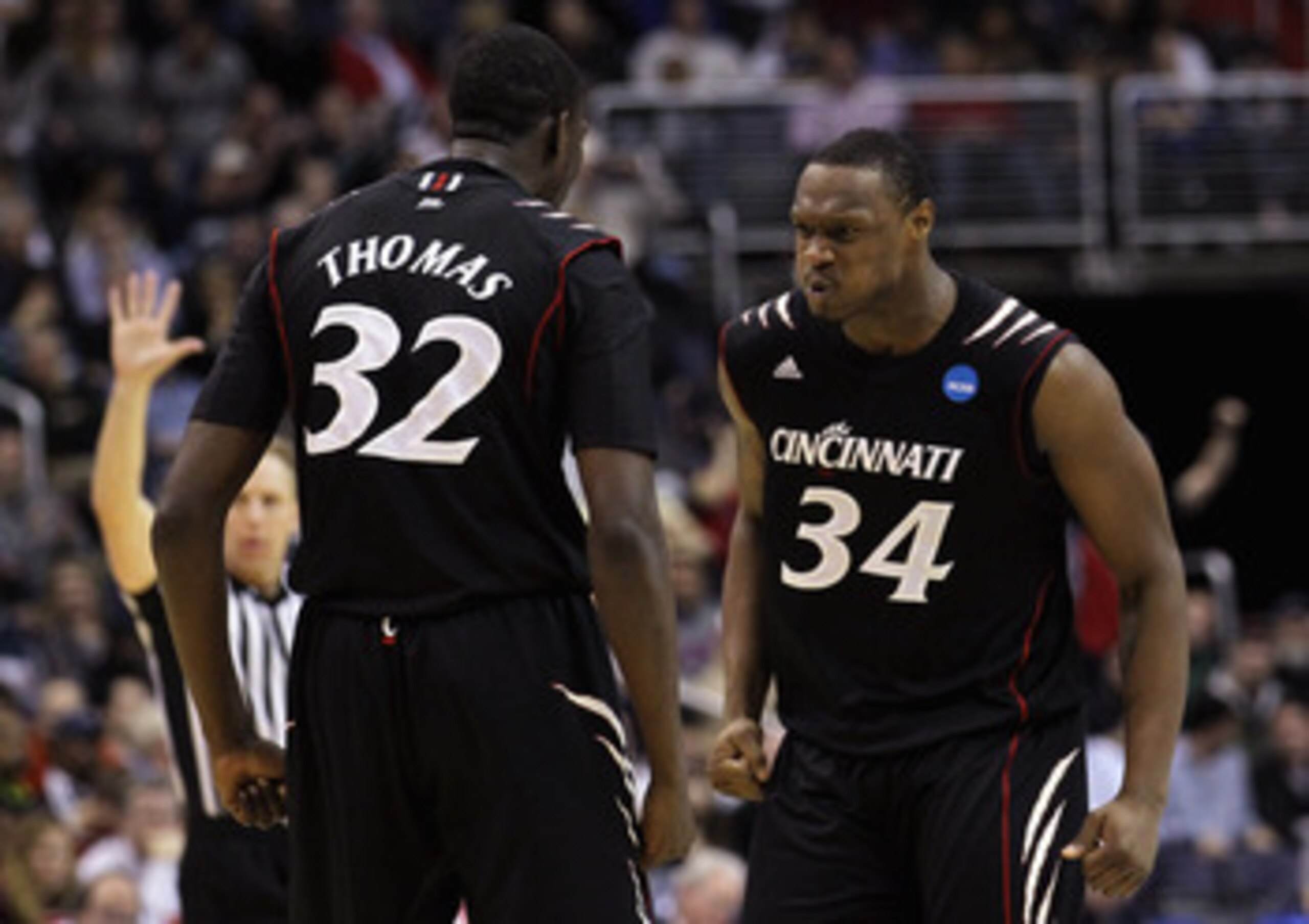 WASHINGTON - MARCH 19:  Ibrahima Thomas #32 of Cincinnati celebrates with teammate Yancy Gates #34 against Connecticut during the third round of the 2011 NCAA men's basketball tournament at Verizon Center on March 19, 2011 in Washington, DC.  (Photo by Ni