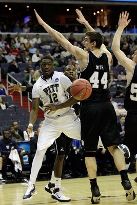 WASHINGTON - MARCH 19:  Ashton Gibbs #12 of the Pittsburgh Panthers passes around Andrew Smith #44 of the Butler Bulldogs during the third round of the 2011 NCAA men's basketball tournament at Verizon Center on March 19, 2011 in Washington, DC.  (Photo by