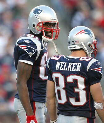 FOXBORO, MA - NOVEMBER 8:  Randy Moss #81 of the New England Patriots reacts with teammate Wes Welker #83 during a game against the Miami Dolphins at Gillette Stadium on November 8, 2009 in Foxboro, Massachusetts. The Patriots won 27-17. (Photo by Jim Rog