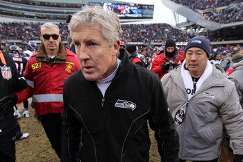 CHICAGO, IL - JANUARY 16:  Head coach Pete Carroll of the Seattle Seahawks runs off the field after the Seahawks 35-24 defeat to the Chicago Bears in the 2011 NFC divisional playoff game at Soldier Field on January 16, 2011 in Chicago, Illinois.  (Photo b