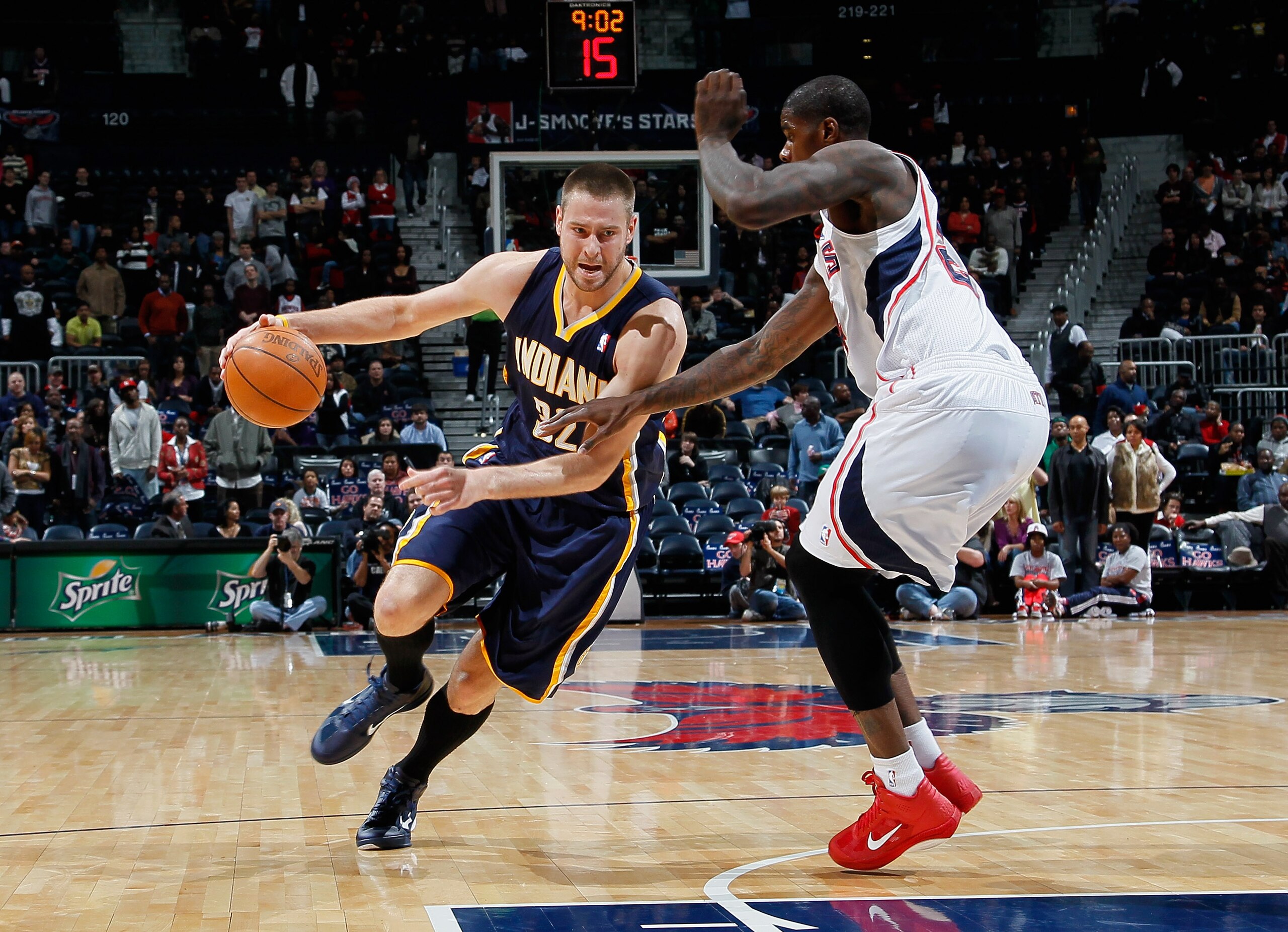 ATLANTA, GA - DECEMBER 11:  Josh McRoberts #32 of the Indiana Pacers against Marvin Williams #24 of the Atlanta Hawks at Philips Arena on December 11, 2010 in Atlanta, Georgia.  NOTE TO USER: User expressly acknowledges and agrees that, by downloading and
