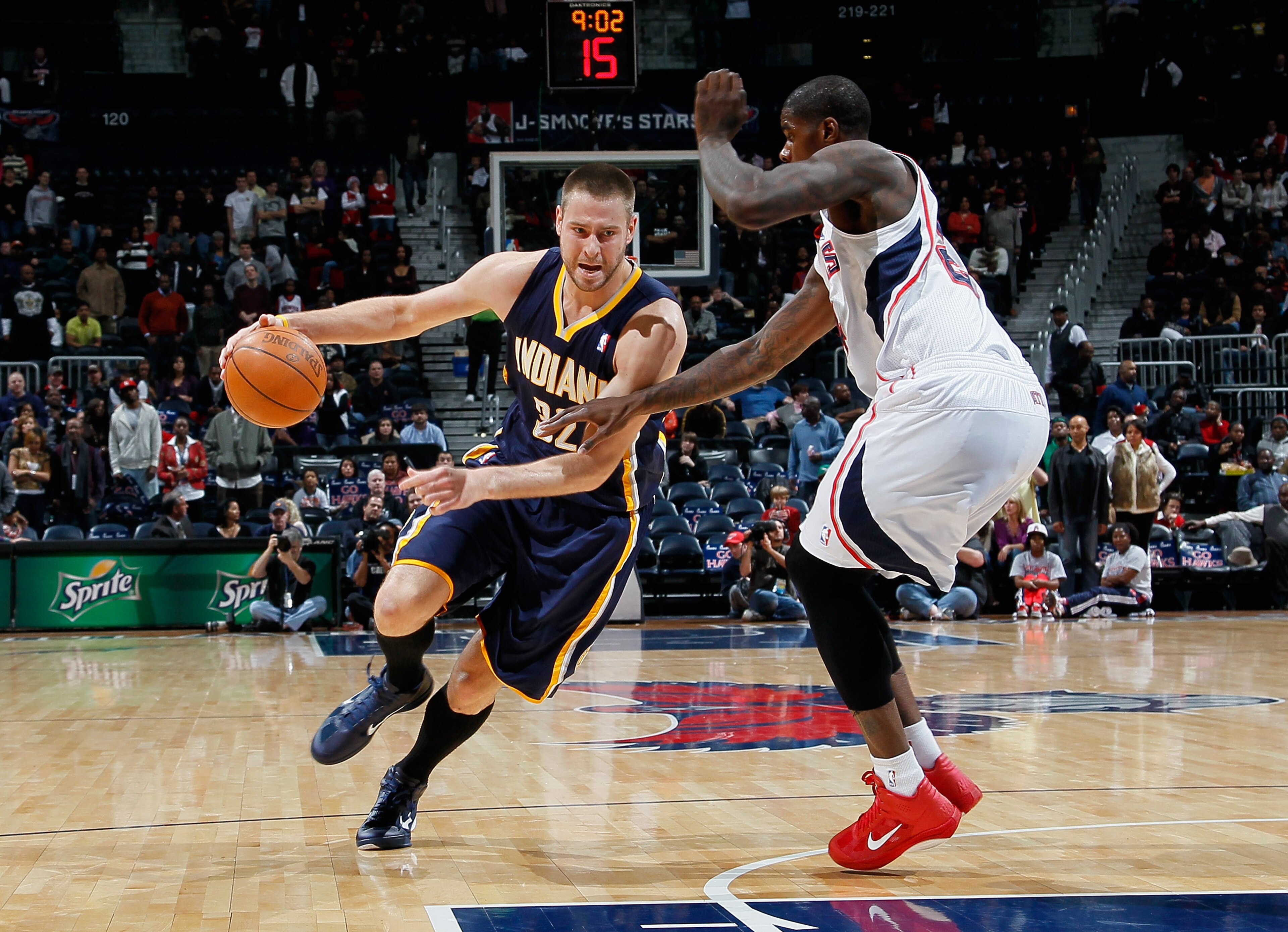 ATLANTA, GA - DECEMBER 11: Josh McRoberts #32 of the Indiana Pacers against Marvin Williams #24 of the Atlanta Hawks at Philips Arena on December 11, 2010 in Atlanta, Georgia. NOTE TO USER: User expressly acknowledges and agrees that, by downloading and ATLANTA, GA - DECEMBER 11: Josh McRoberts #32 of the Indiana Pacers against Marvin Williams #24 of the Atlanta Hawks at Philips Arena on December 11, 2010 in Atlanta, Georgia. NOTE TO USER: User expressly acknowledges and agrees that, by downloading and