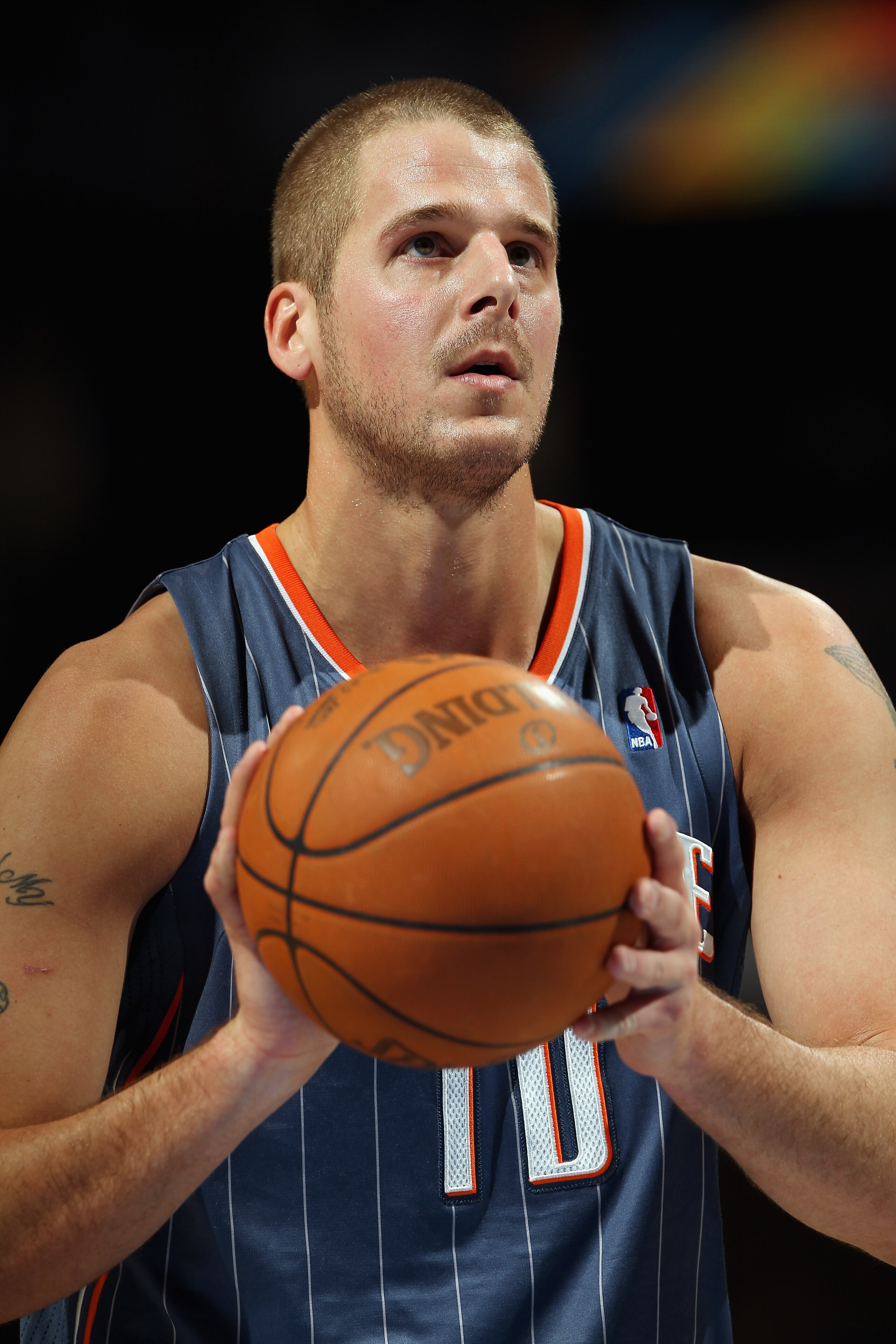DENVER, CO - MARCH 02:  Joel Pryzbilla #10 of the Charlotte Bobcats takes a free throw against the Denver Nuggets at the Pepsi Center on March 2, 2011 in Denver, Colorado. The Nuggets defeated the Bobcats 120-80.NOTE TO USER: User expressly acknowledges a