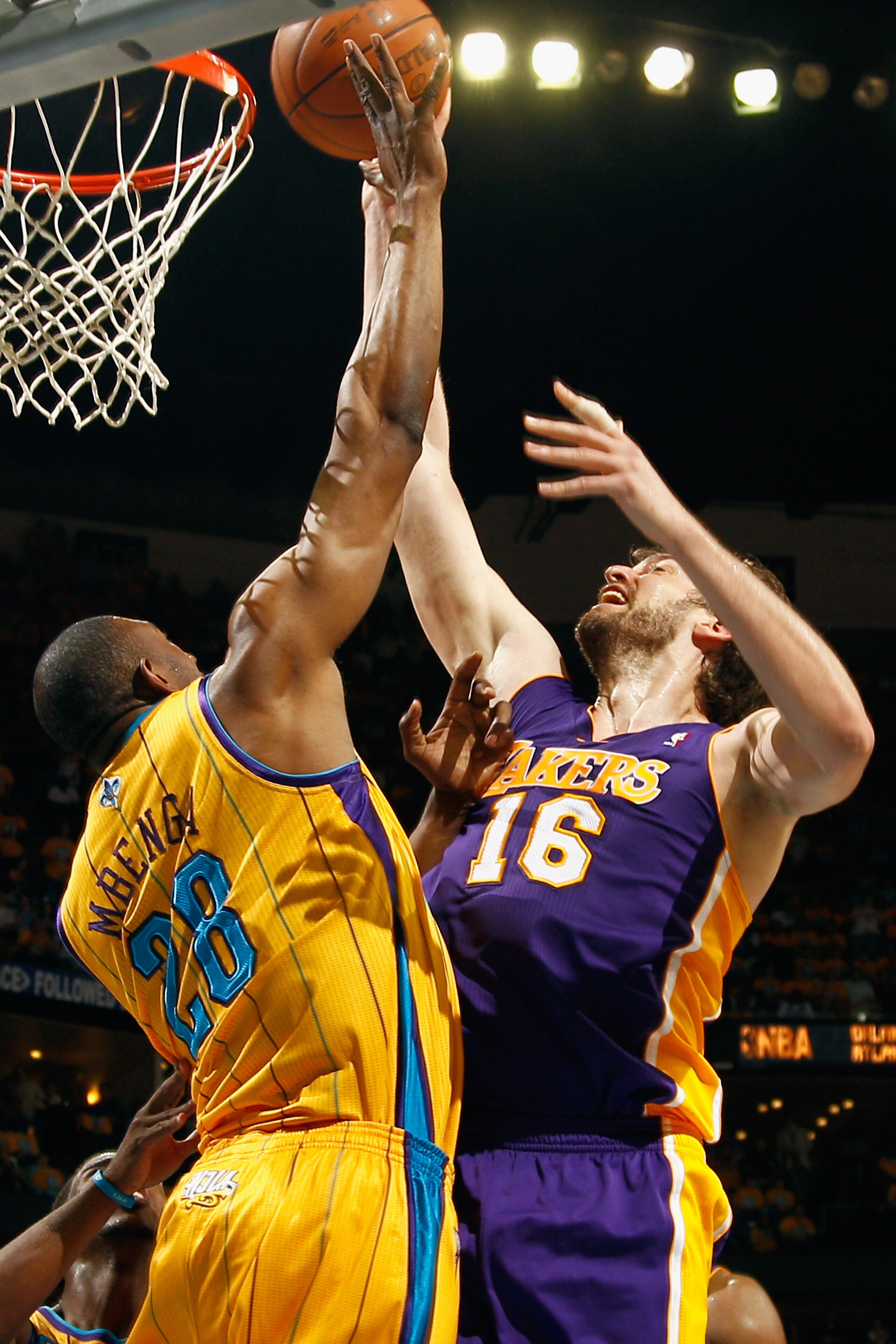 NEW ORLEANS, LA - APRIL 22:  Pau Gasol #16 of the Los Angeles Lakers shoots the ball over D.J. Mbenga #28 of the New Orleans Hornets in Game Three of the Western Conference Quarterfinals in the 2011 NBA Playoffs at the New Orleans Arena  on April 22, 2011